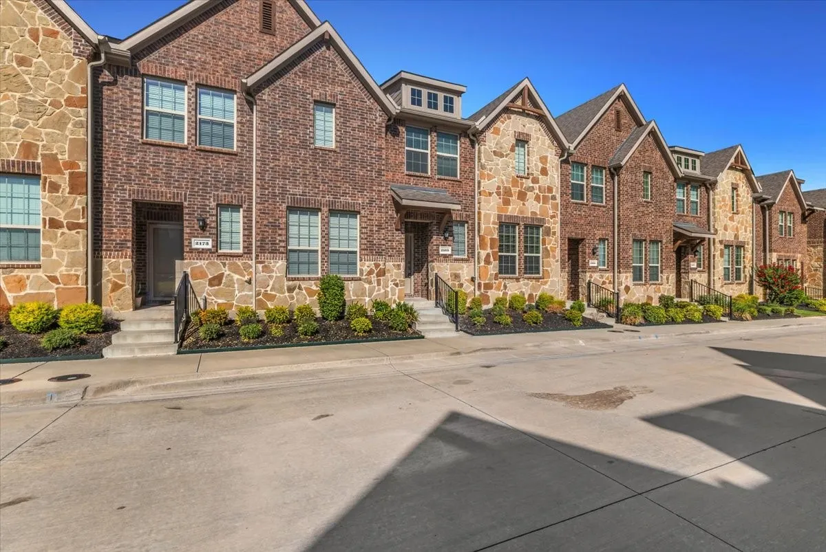 Brick and stone facade with gabled rooflines