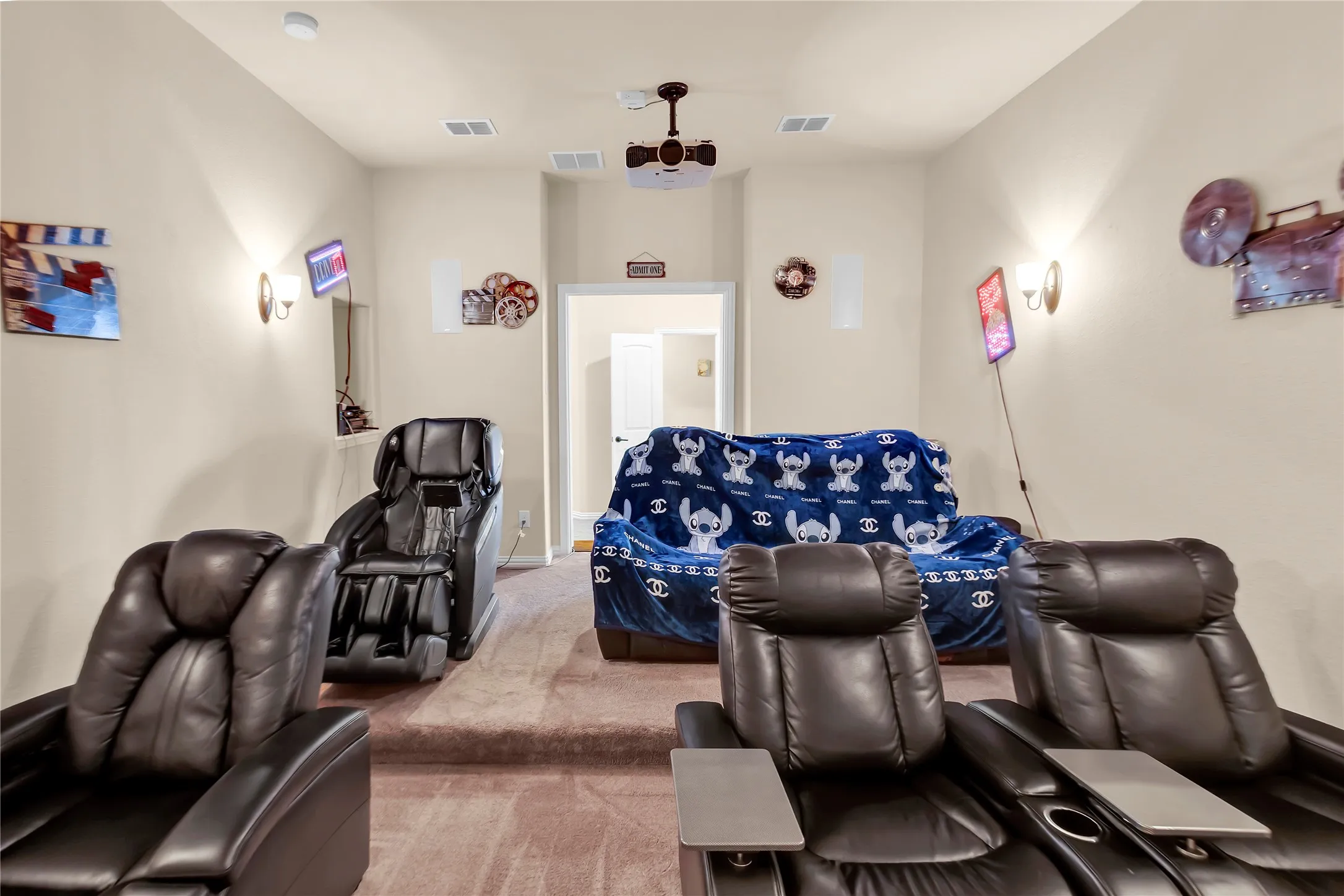 Vaulted ceiling with a ceiling fan, neutral wall paint, and gray carpet flooring
