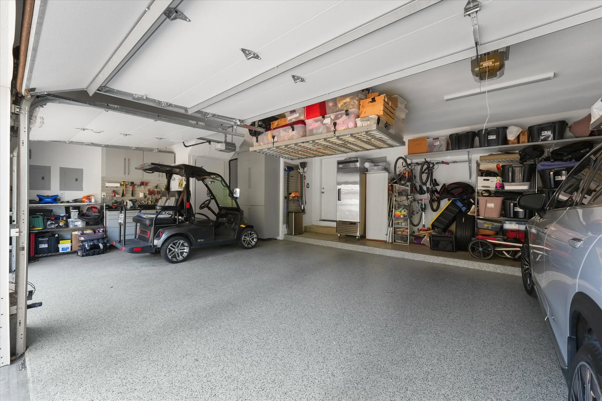 Ceiling-mounted motorized storage racks, with epoxy coated floor.