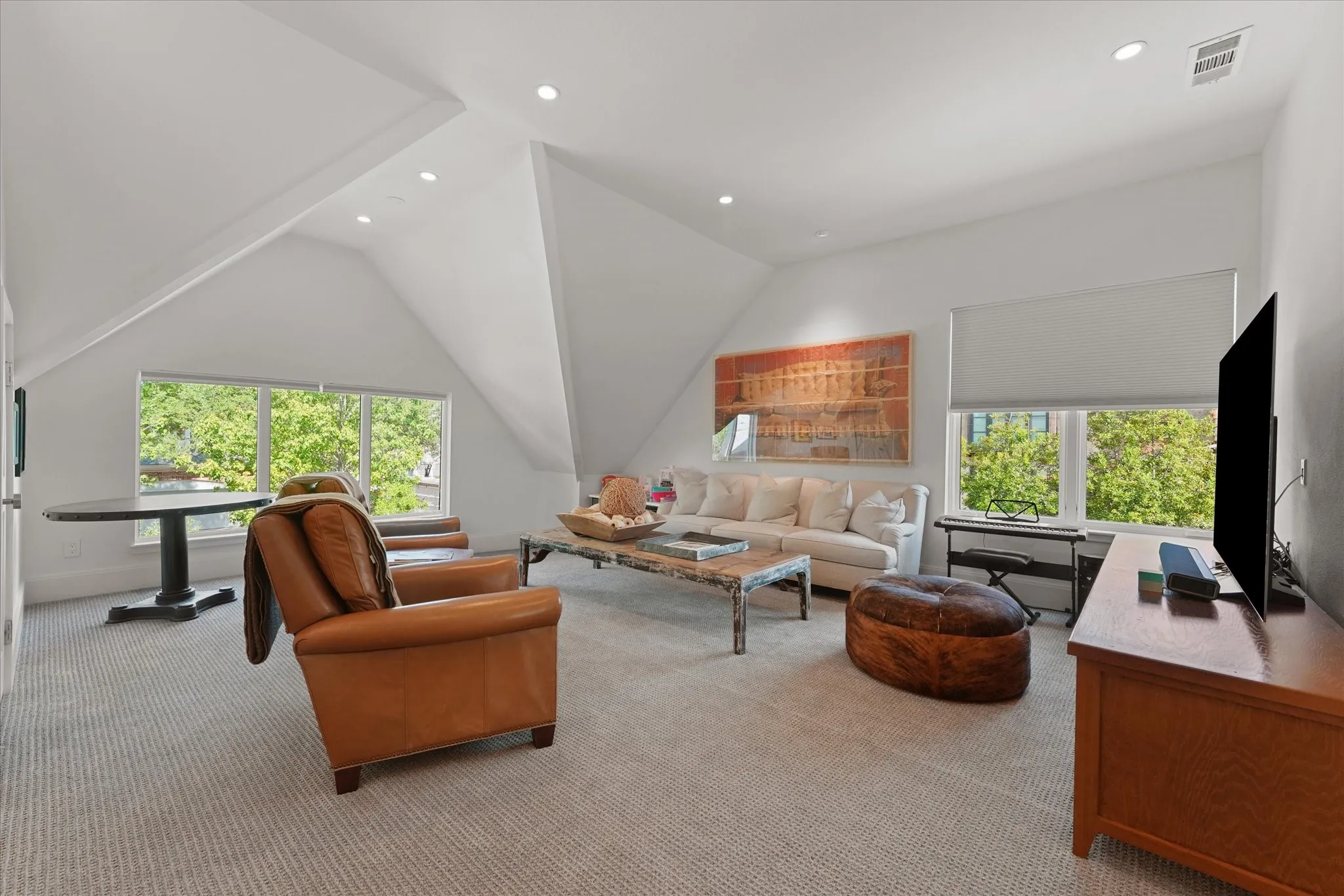 Spacious room with custom built-in cabinets.