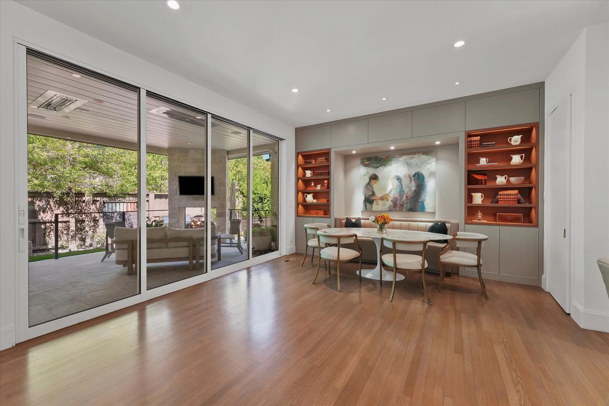 Cushioned banquette beside sliding glass doors overlooking the covered patio.