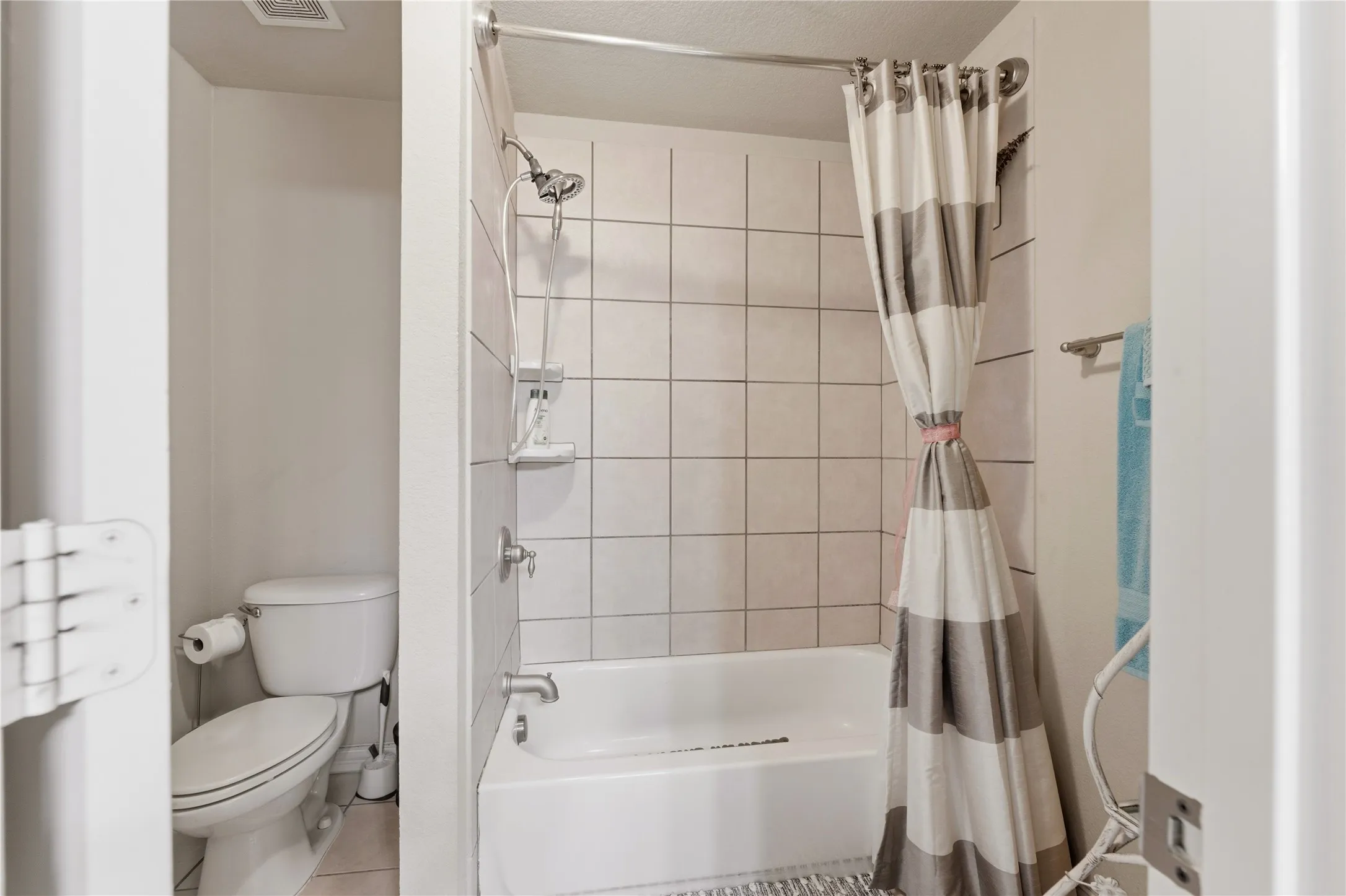 Tub shower combination with tiled surround