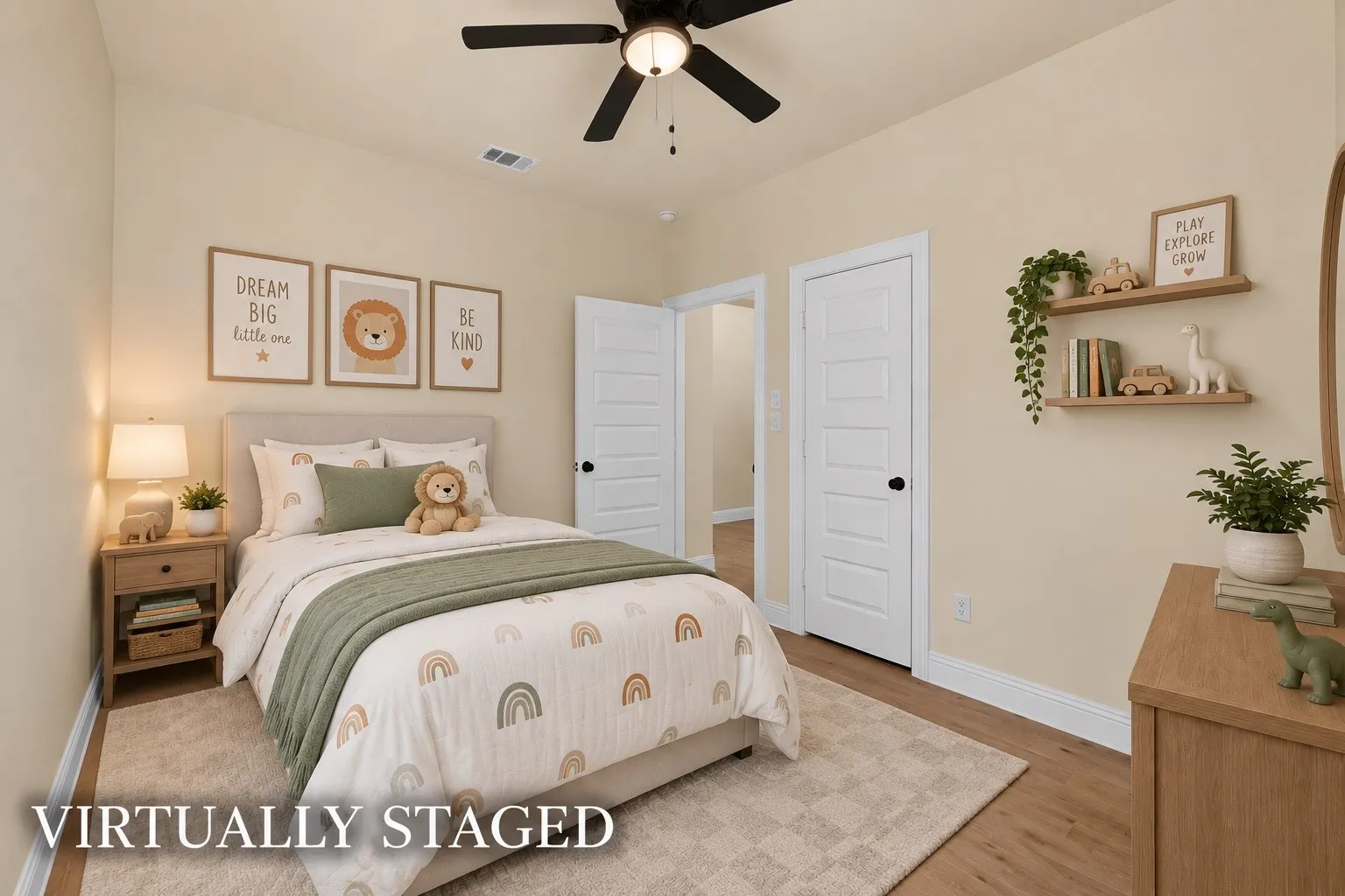 Wood-finish flooring, white paneled doors, ceiling fan with integrated lighting, and built-in wall shelving