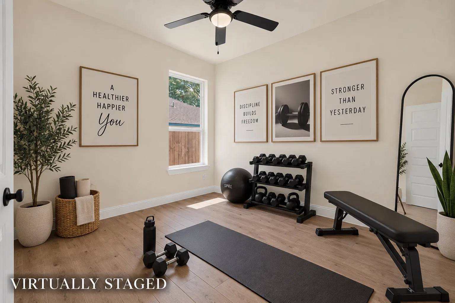 Bright interior space featuring wood-finish flooring, a single window, and a ceiling fan with integrated lighting