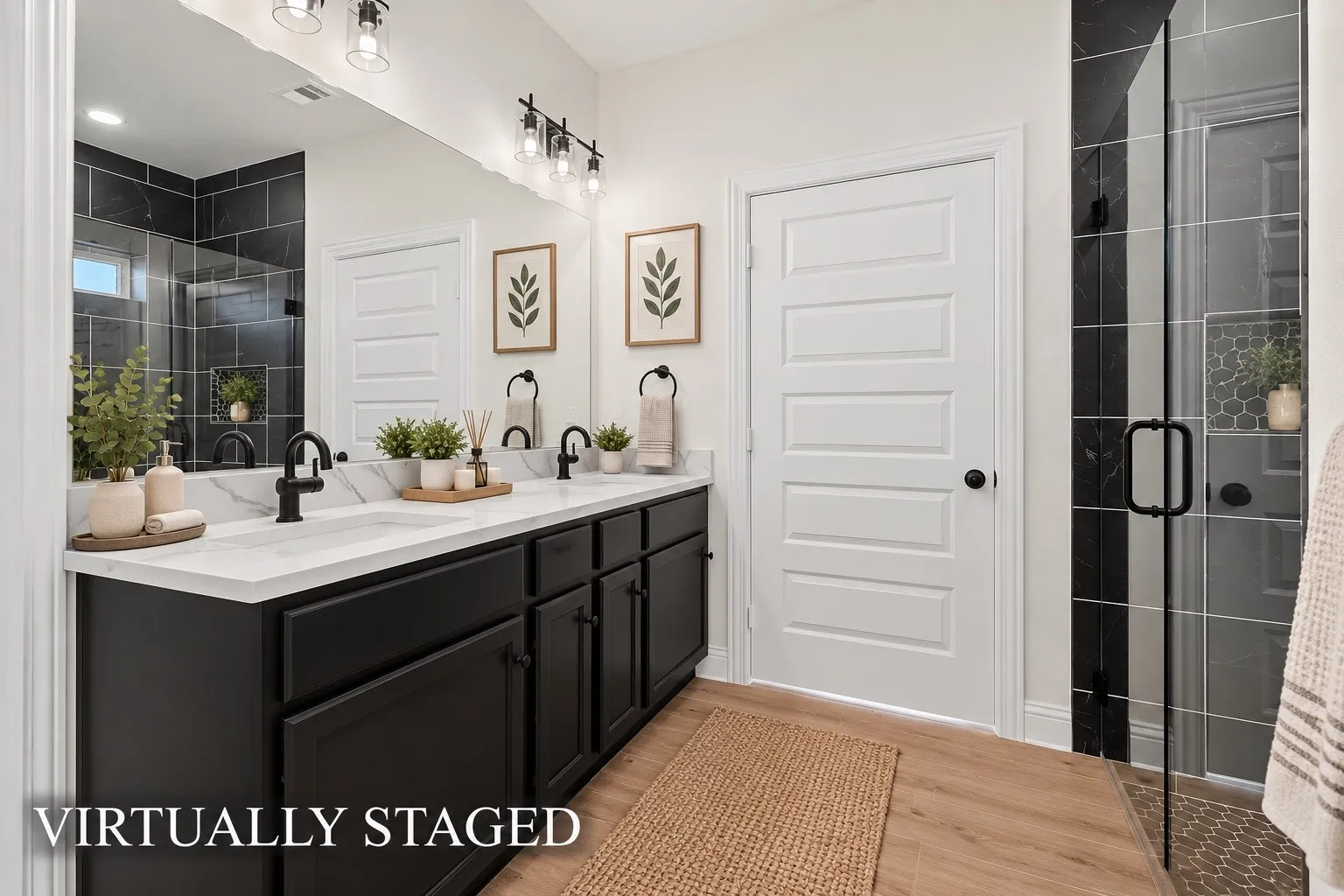 Dual vanity with white countertop, black cabinetry, and matte black fixtures