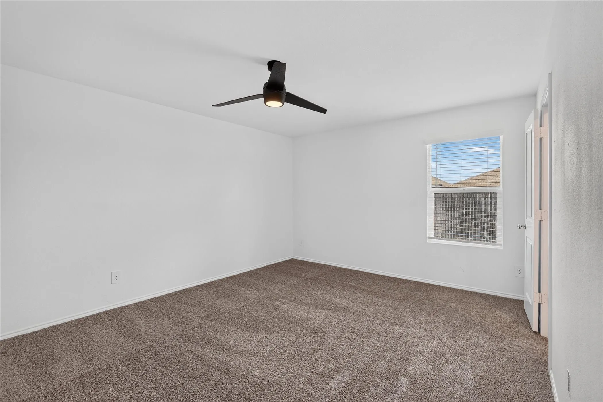 Neutral wall color with carpet flooring
