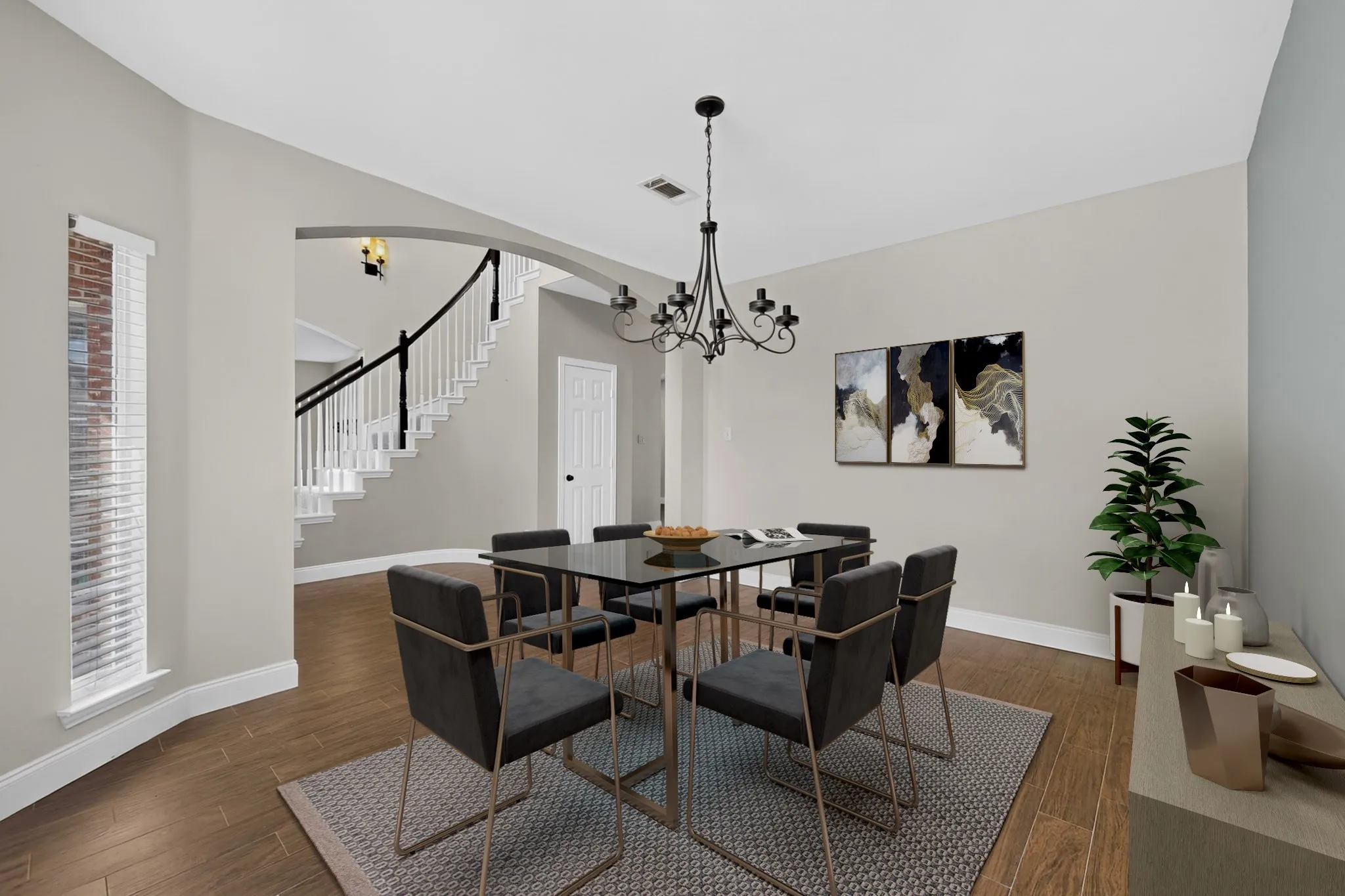 Neutral paint palette, wood-finish flooring, a contemporary chandelier, and an arched doorway. T