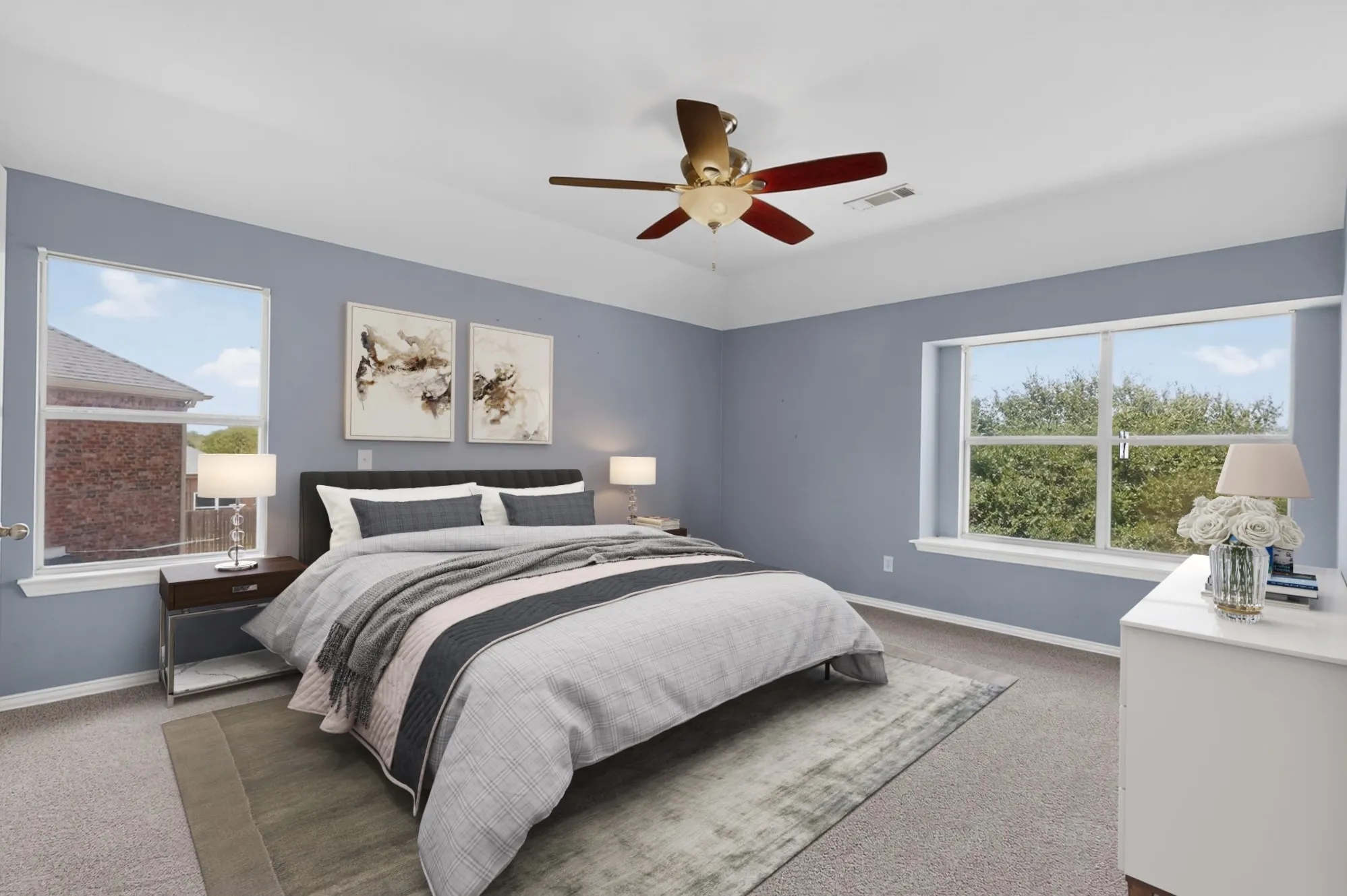 Recessed ceiling with an integrated ceiling fan. This photo has been virtually staged.