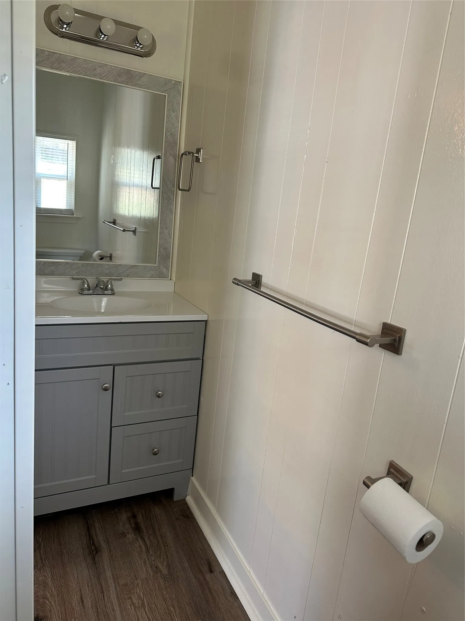 MBTH with vanity and waterproof flooring.