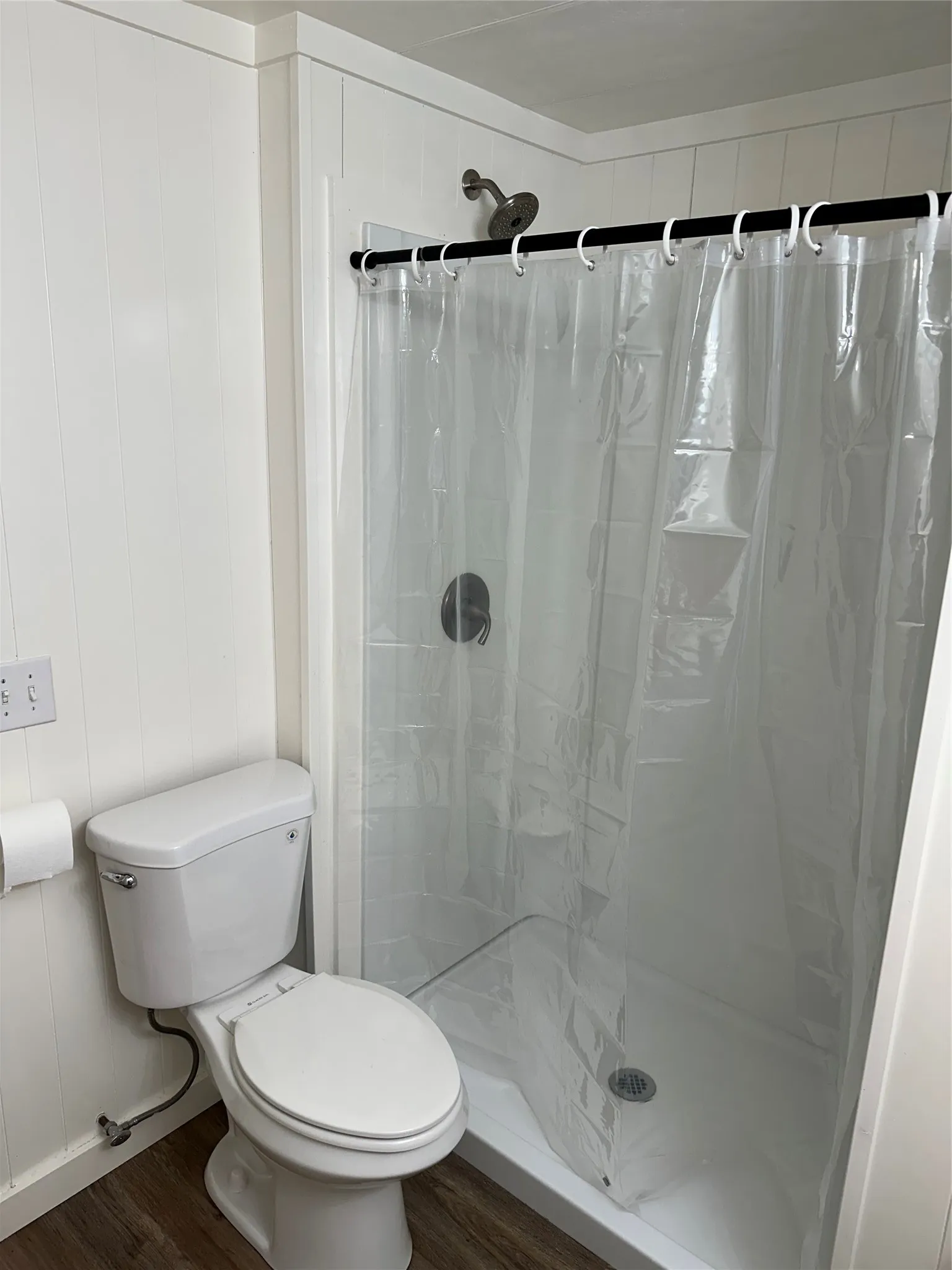 Full bathroom featuring large walk-in newly installed shower.