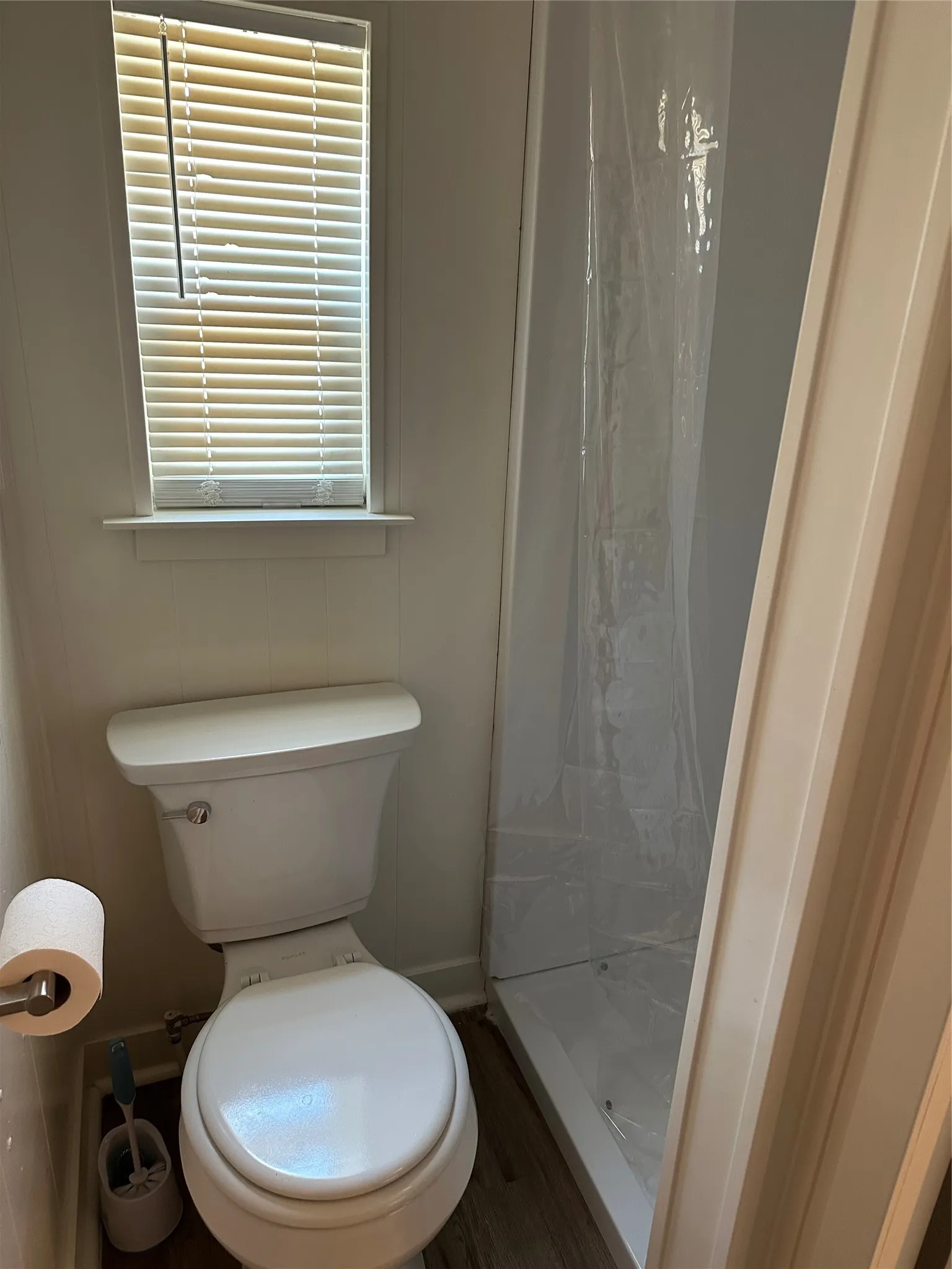 MBTH featuring a stall shower and waterproof finished floors