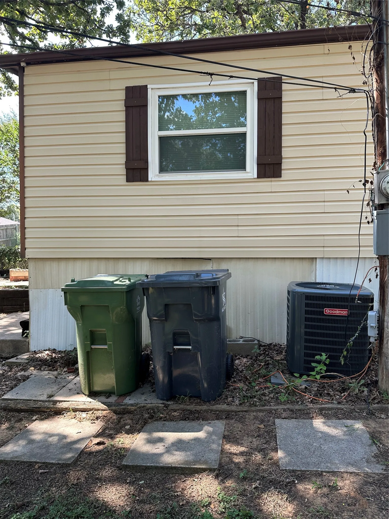View of side of property with a recently installed Goodman central air condition unit