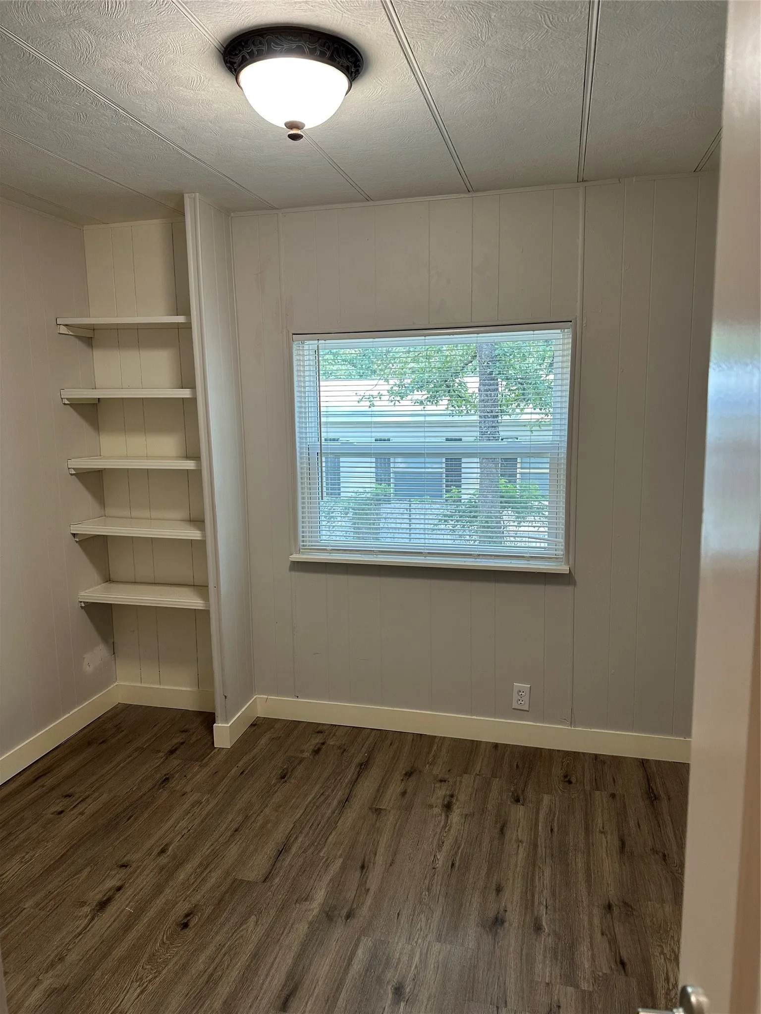 3rd Bedroom featuring built-in shelves.