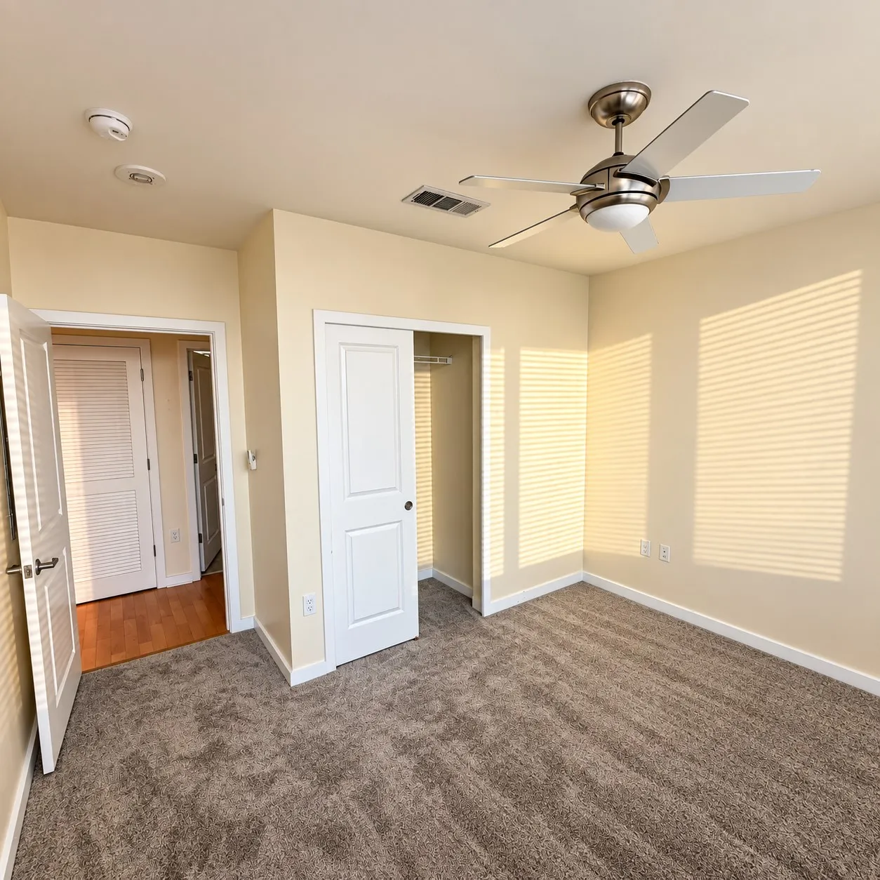 Plush carpet flooring, recessed lighting, and a ceiling fan with integrated lighting