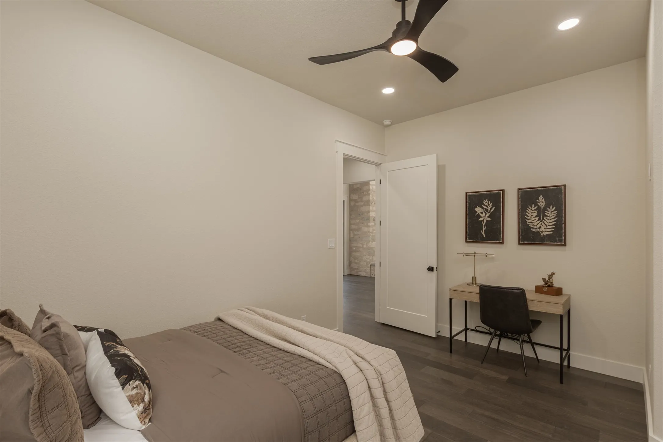 Wood-finish flooring, recessed lighting, and a contemporary ceiling fan