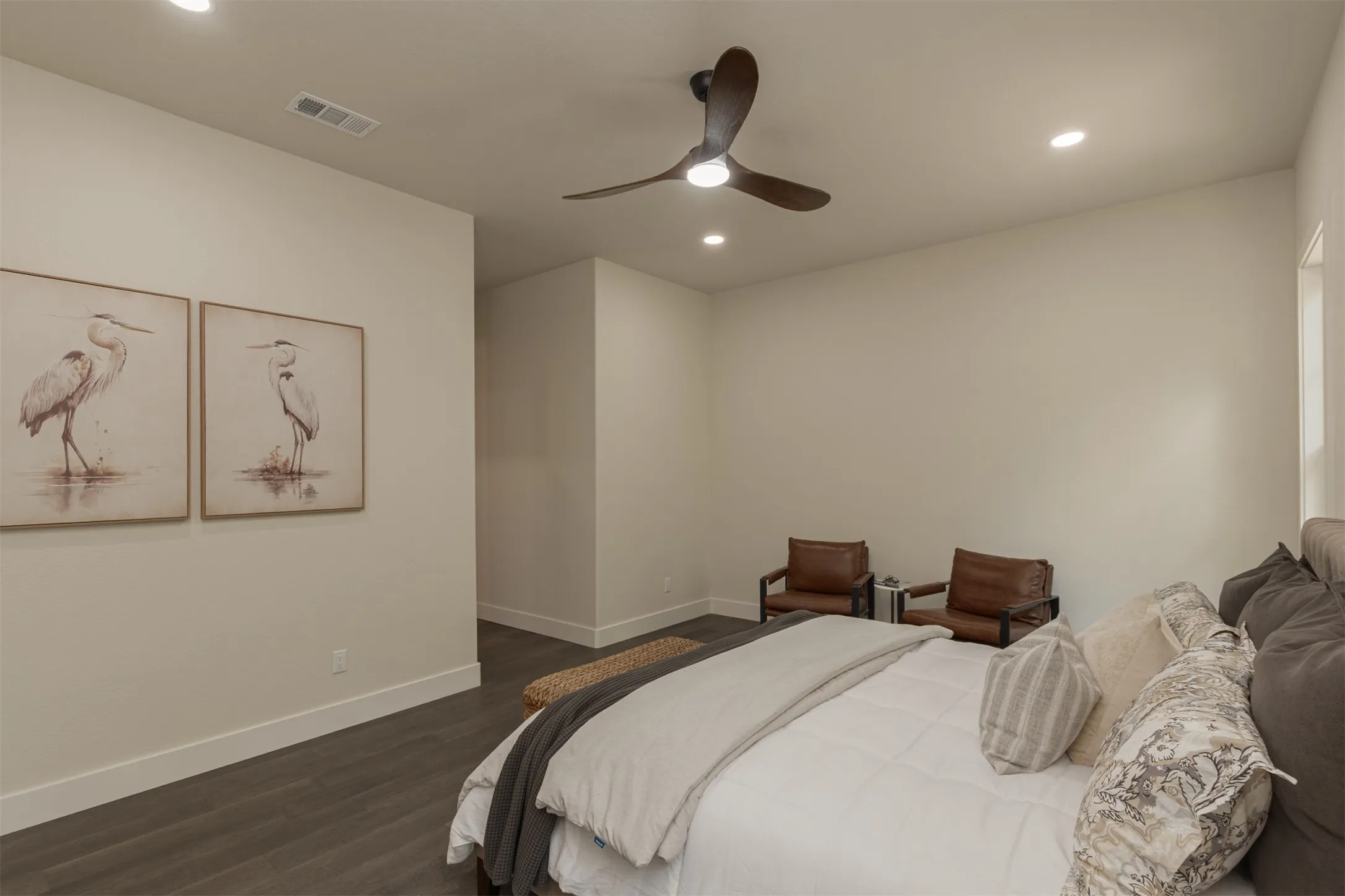 Wood-finish flooring, recessed lighting, and a contemporary ceiling fan with integrated lighting