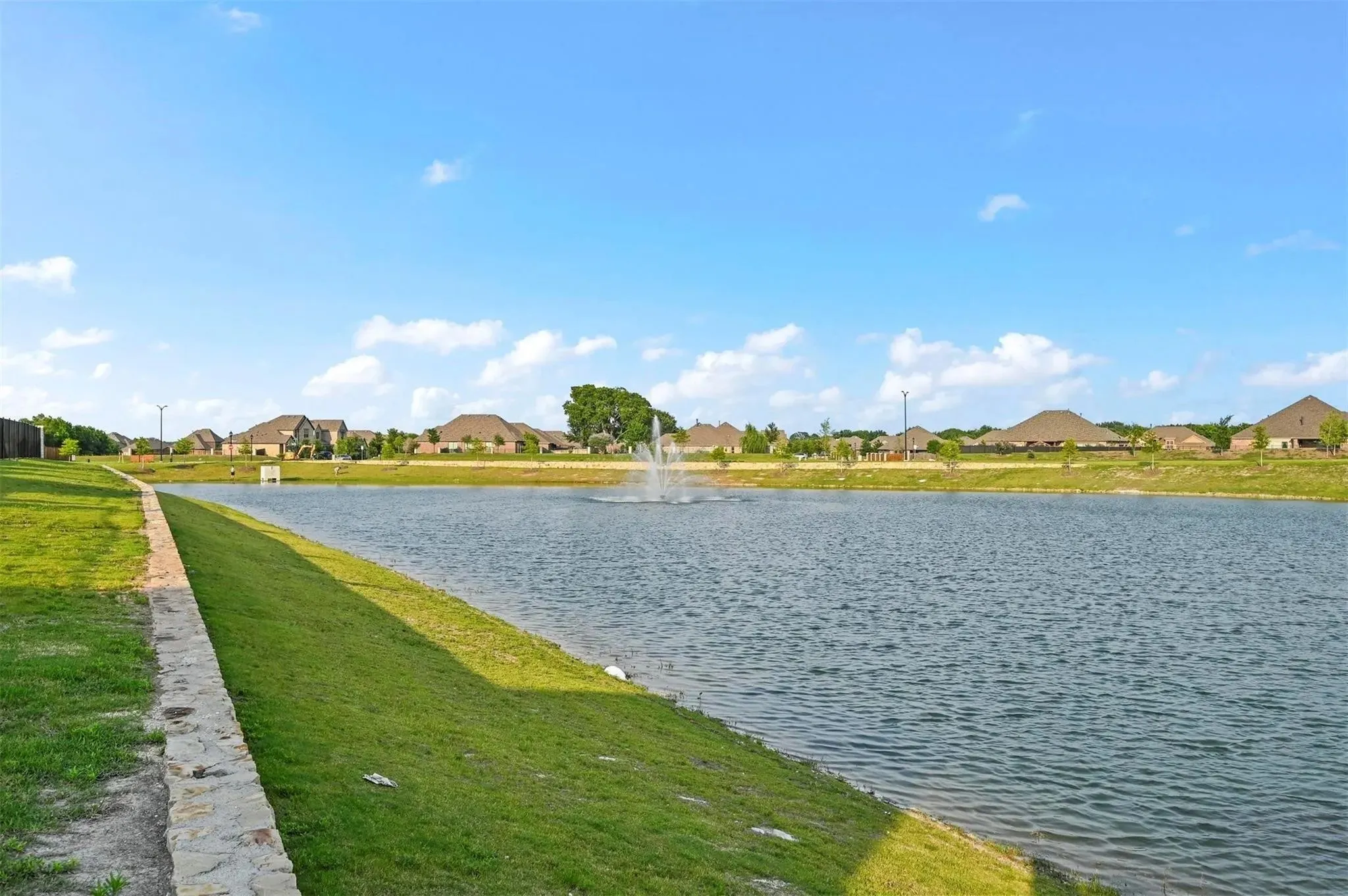 Expansive body of water featuring a central fountain