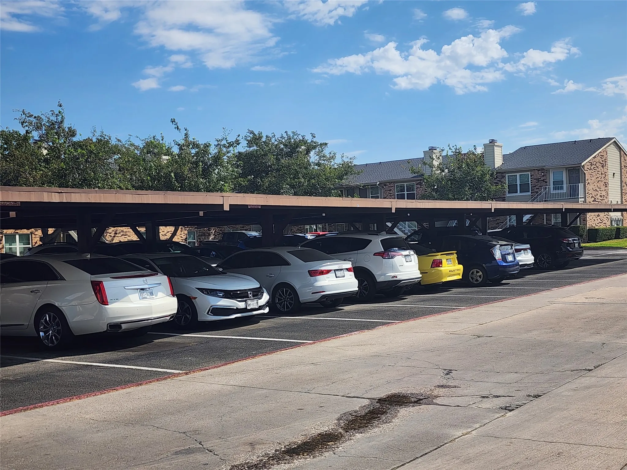 Covered parking structure with designated parking spaces