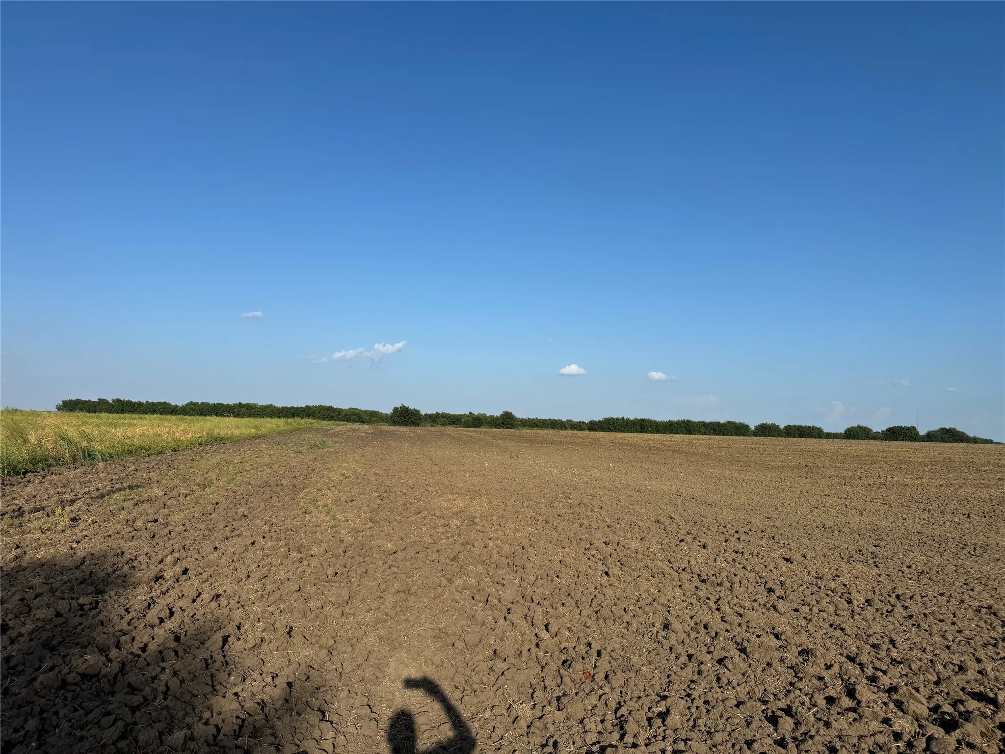 Expansive land offering a wide-open field and clear sky