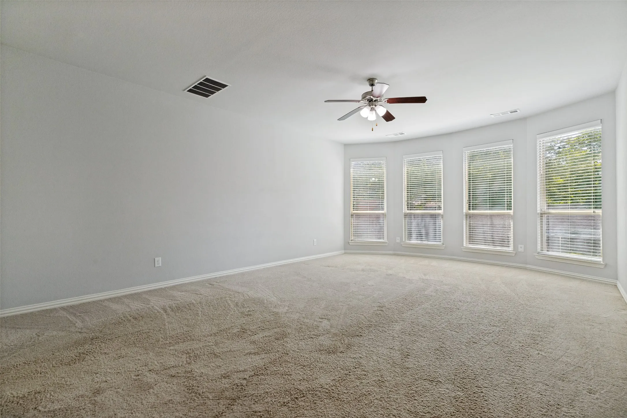 Private master suite with numerous windows for natural light creating a luxurious and comfortable living space. Super quiet, relaxing, and a great place to rest after a busy work day. No need to imagine, it is! Located on the main floor at the back of the home.