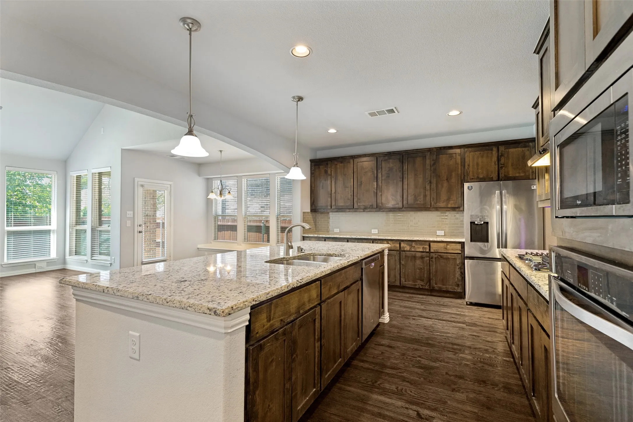 Kitchens are definitely the heart of the home! Cook for two or twenty in this stylish well-appointed kitchen. Beautiful cabinetry provide plenty of storage in this gourmet kitchen. With generous countertops throughout, this home is a dream for the baking enthusiast in the family. Imagine the joy of rolling out an abundance of cookie dough with friends or the little ones in your life, creating cherished moments in this