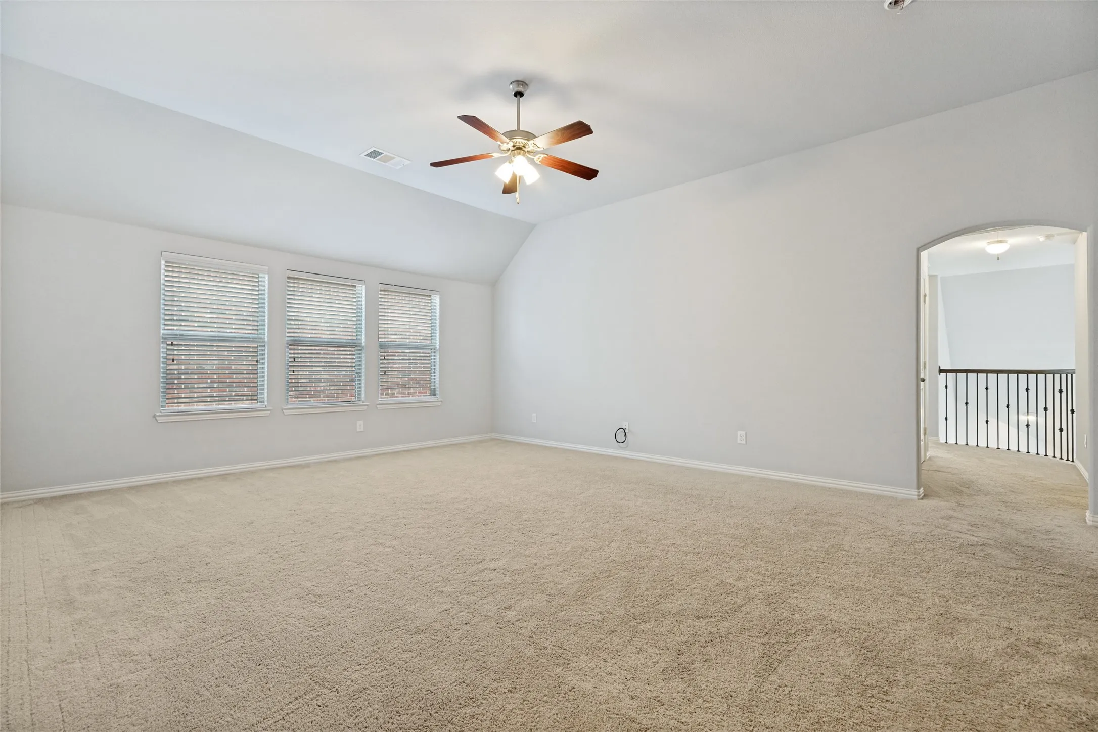 View of the spacious upstairs gameroom. How would your family put this great room to use? Can be a comfortable place for your kids to relax and play with their friends. If your kids are older it's large enough for a pool table, ping-pong table and large screen TV. Let the games begin!! Connected flex room.