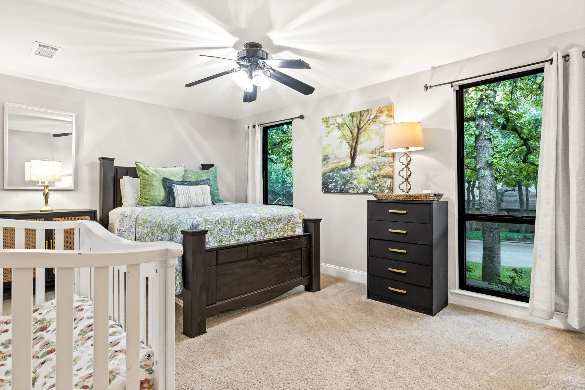 Recessed lighting, ceiling fan, carpet flooring, two large windows, white walls