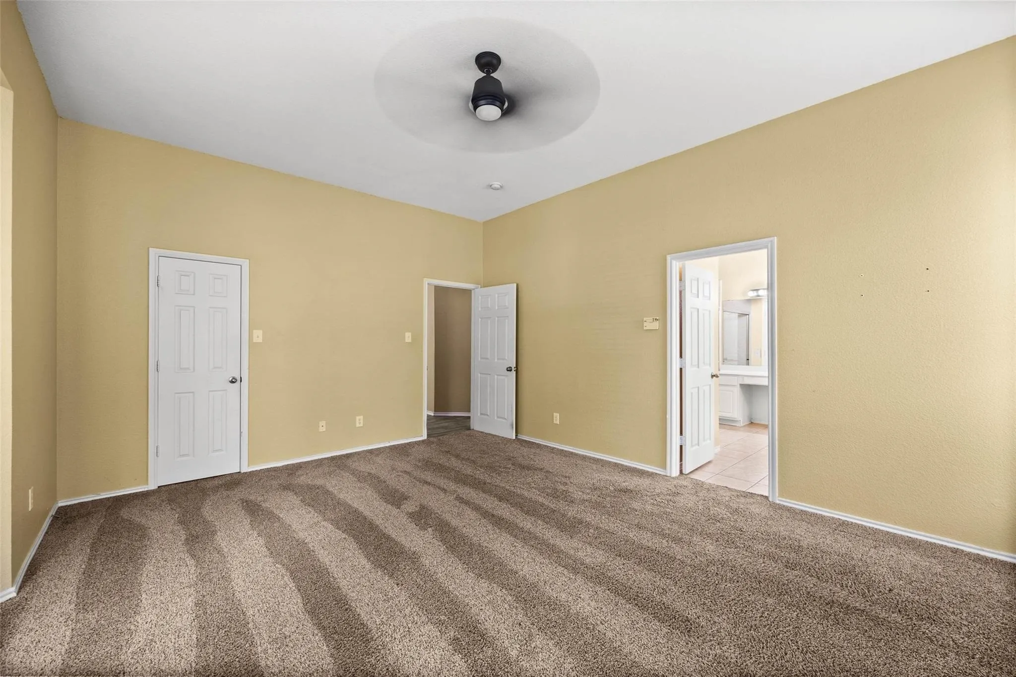 Vaulted ceiling with a flush-mount ceiling fan