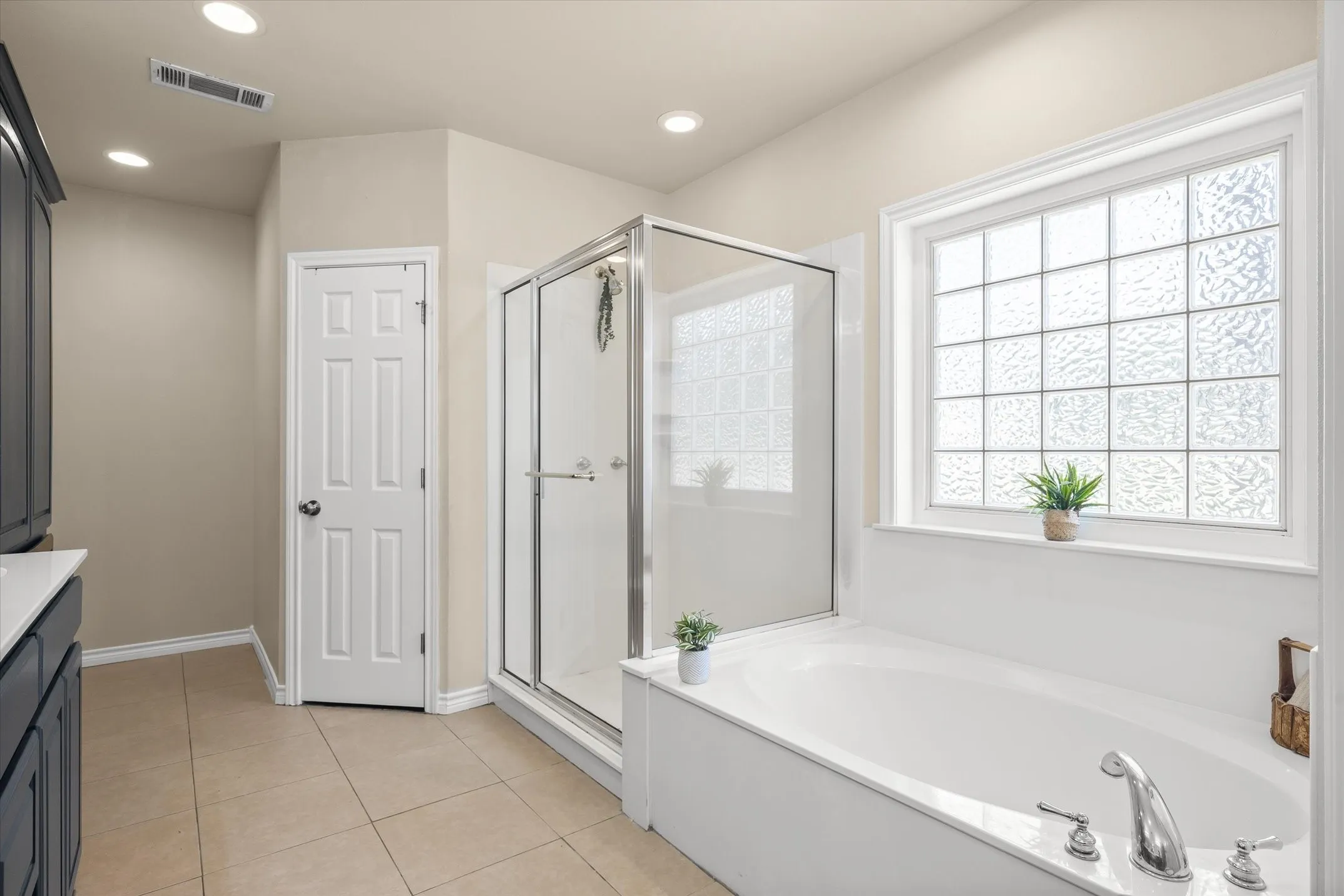 Secondary primary bathroom within the home’s private guest wing