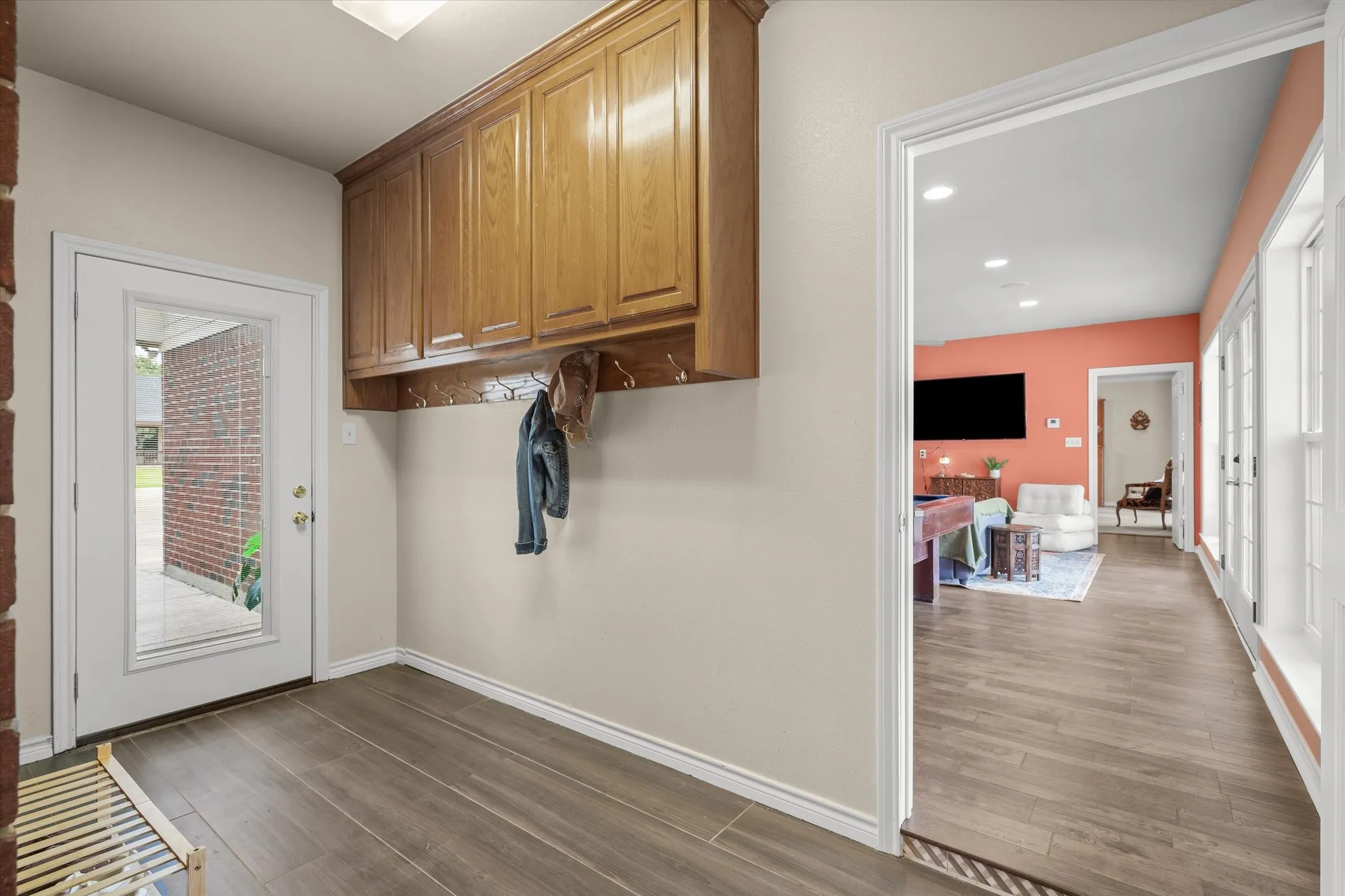 Side entry to exterior and secondary living area within the home's private guest wing