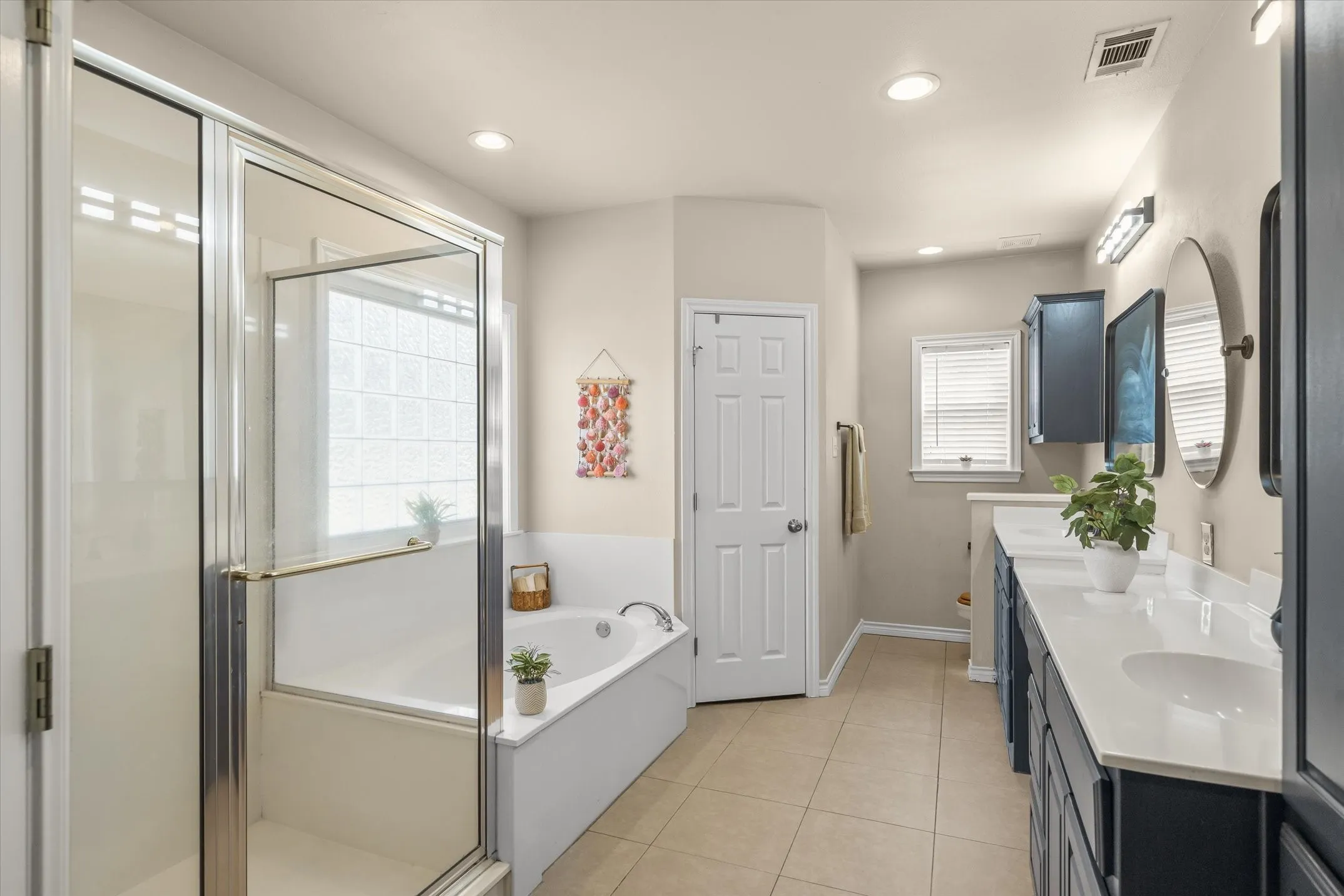 Secondary primary bathroom within the home’s private guest wing