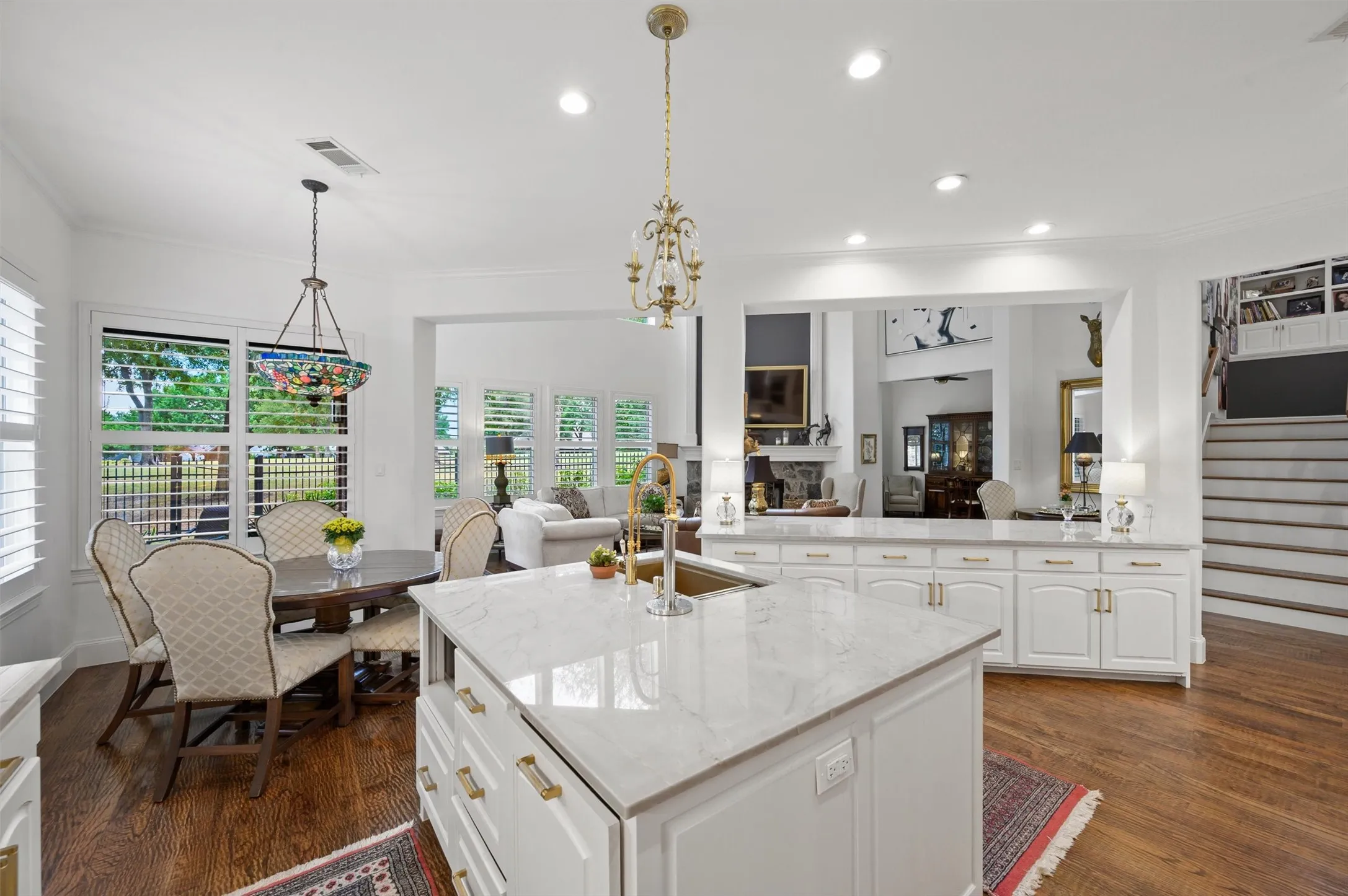 Kitchen island with a light-toned countertop and an undermount sink