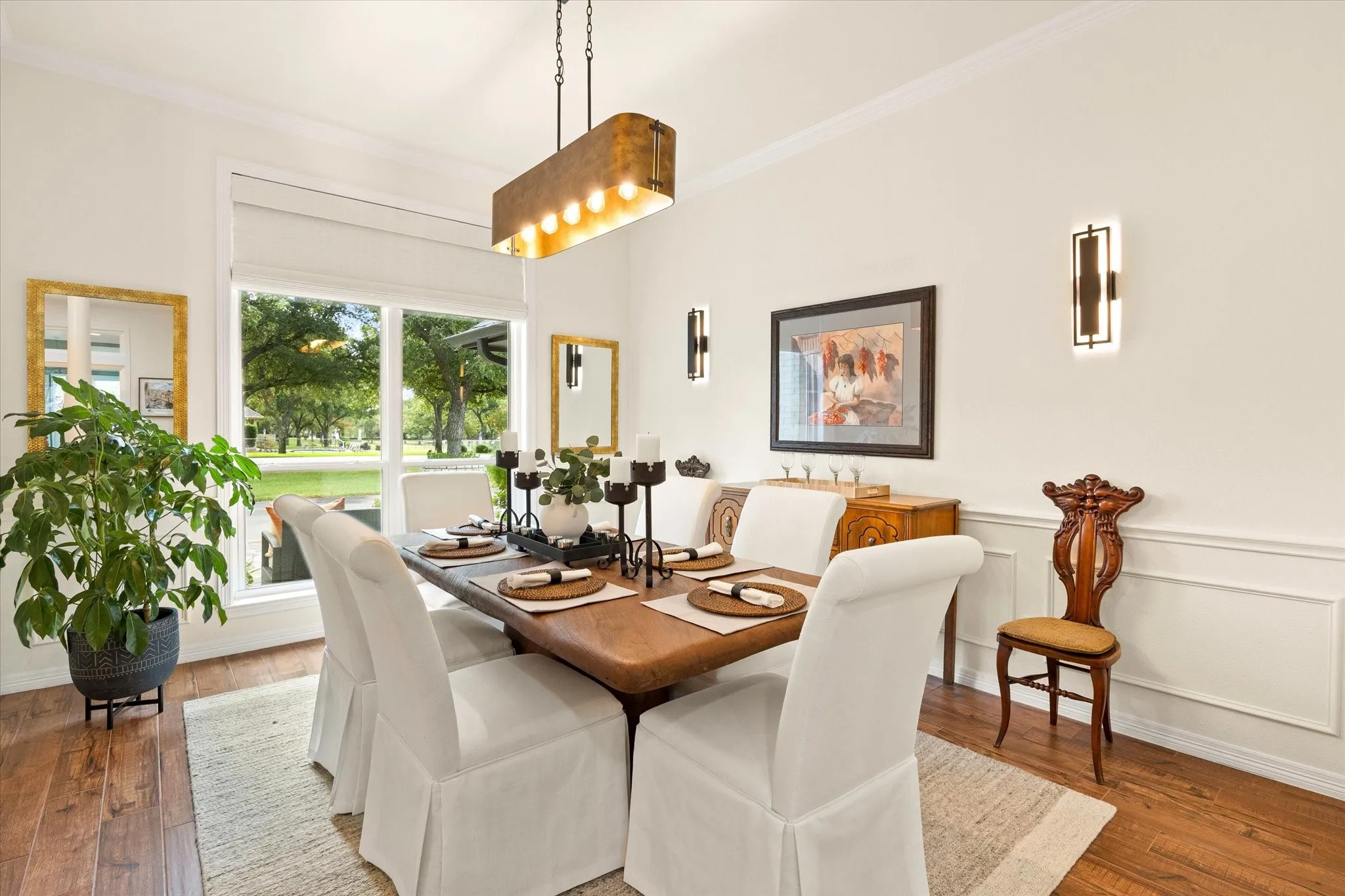 Beautiful Light and Bright Dining with Designer Light Fixtures.  Perfect for Entertaining!