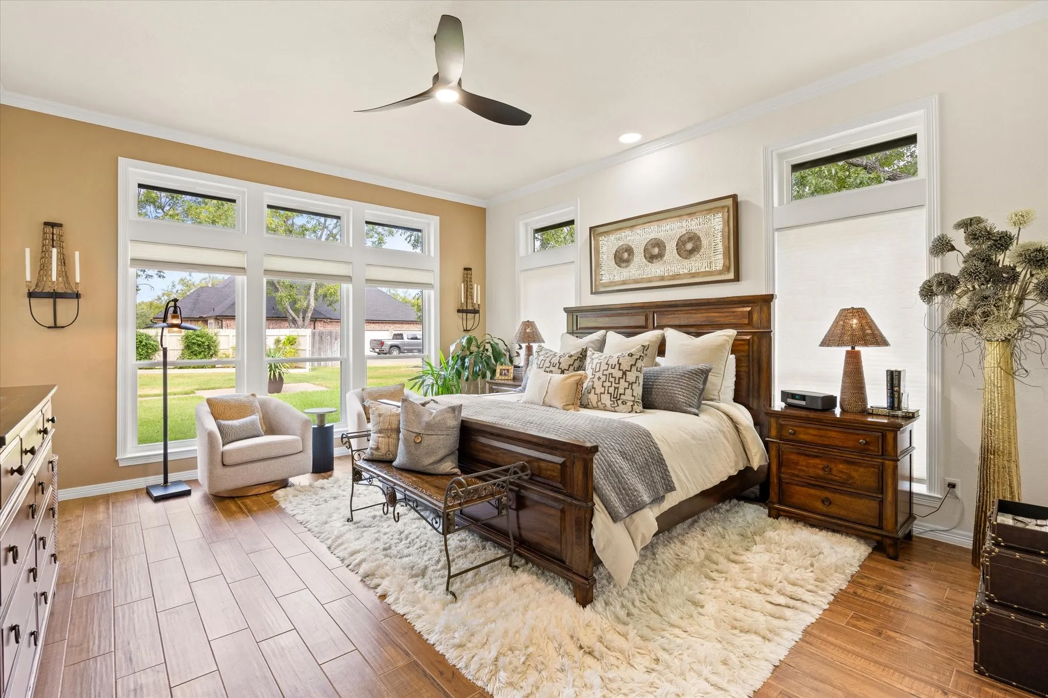Large Primary Bedroom with Wall of Windows and Designer Accent Wall Paint, Overlooks Landscaped Backyard and Golf Course