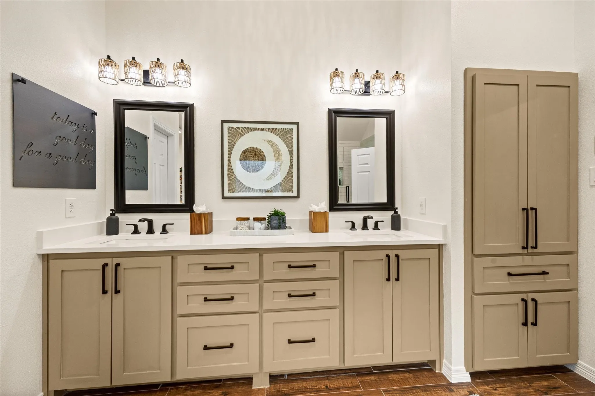Updated Primary Bathroom Featuring Custom Cabinets, Quartz Countertops, Kohler Fixtures, Framed Mirrors, Designer Hardware and Light Fixtures