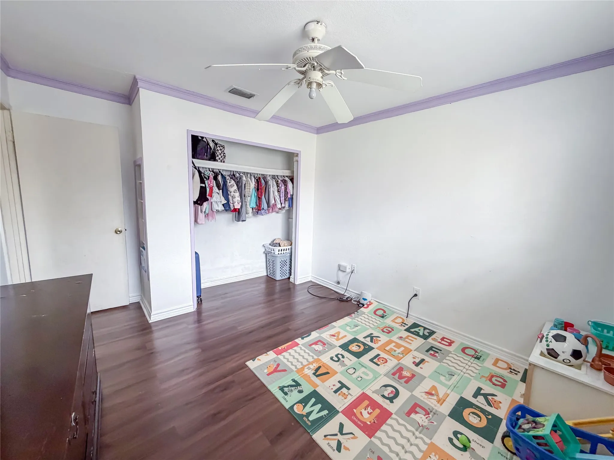 Wood-finish flooring, ceiling fan, and built-in closet space