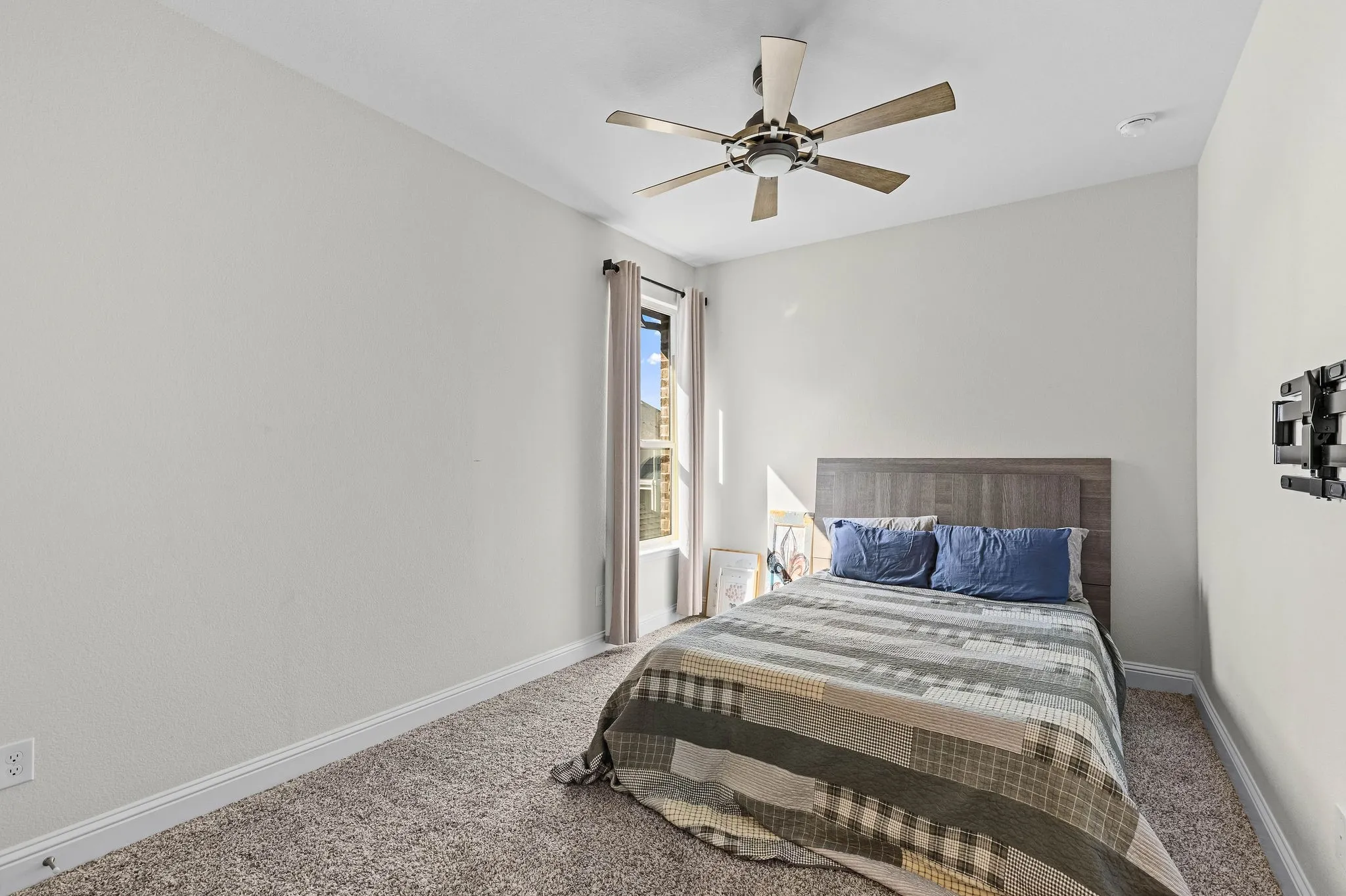Recessed lighting, ceiling fan, window with curtain rod, and neutral wall tones