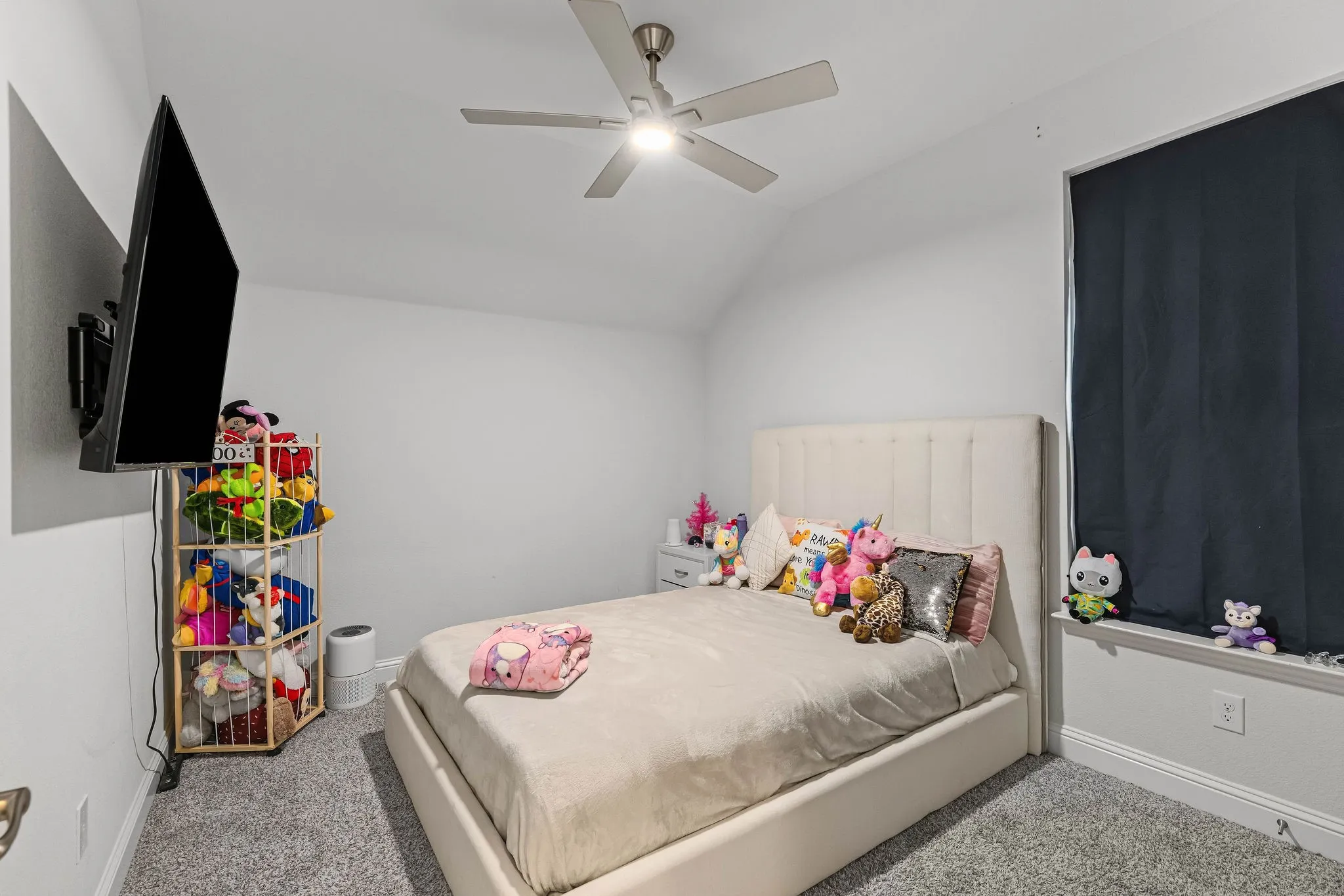 White walls with a textured ceiling and a ceiling fan with integrated lighting