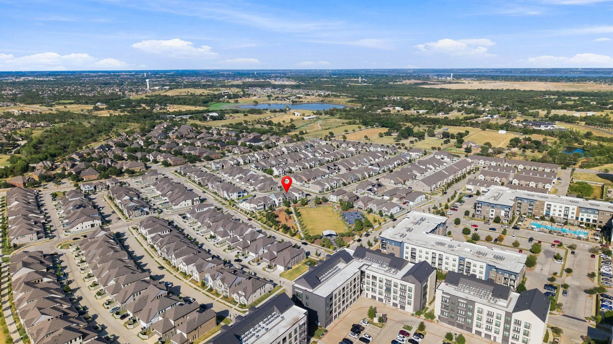 Aerial perspective of a dense residential community with varied architectural styles