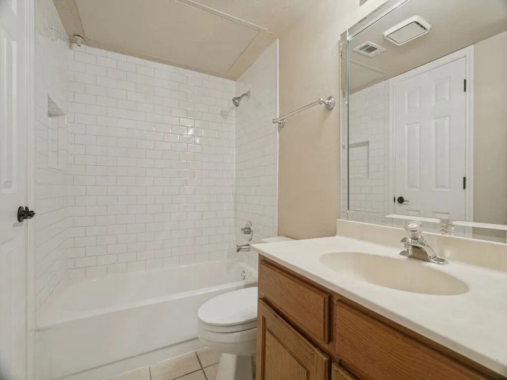 White subway tile shower surround with a built-in niche