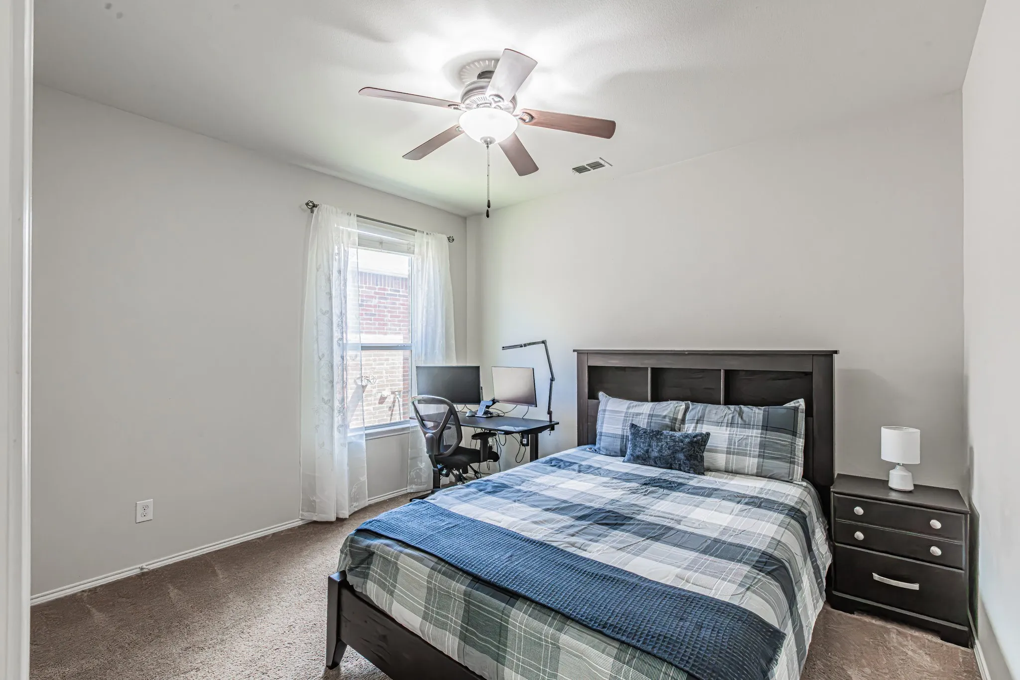 Secondary bedroom with a full size bed to show the extra space.