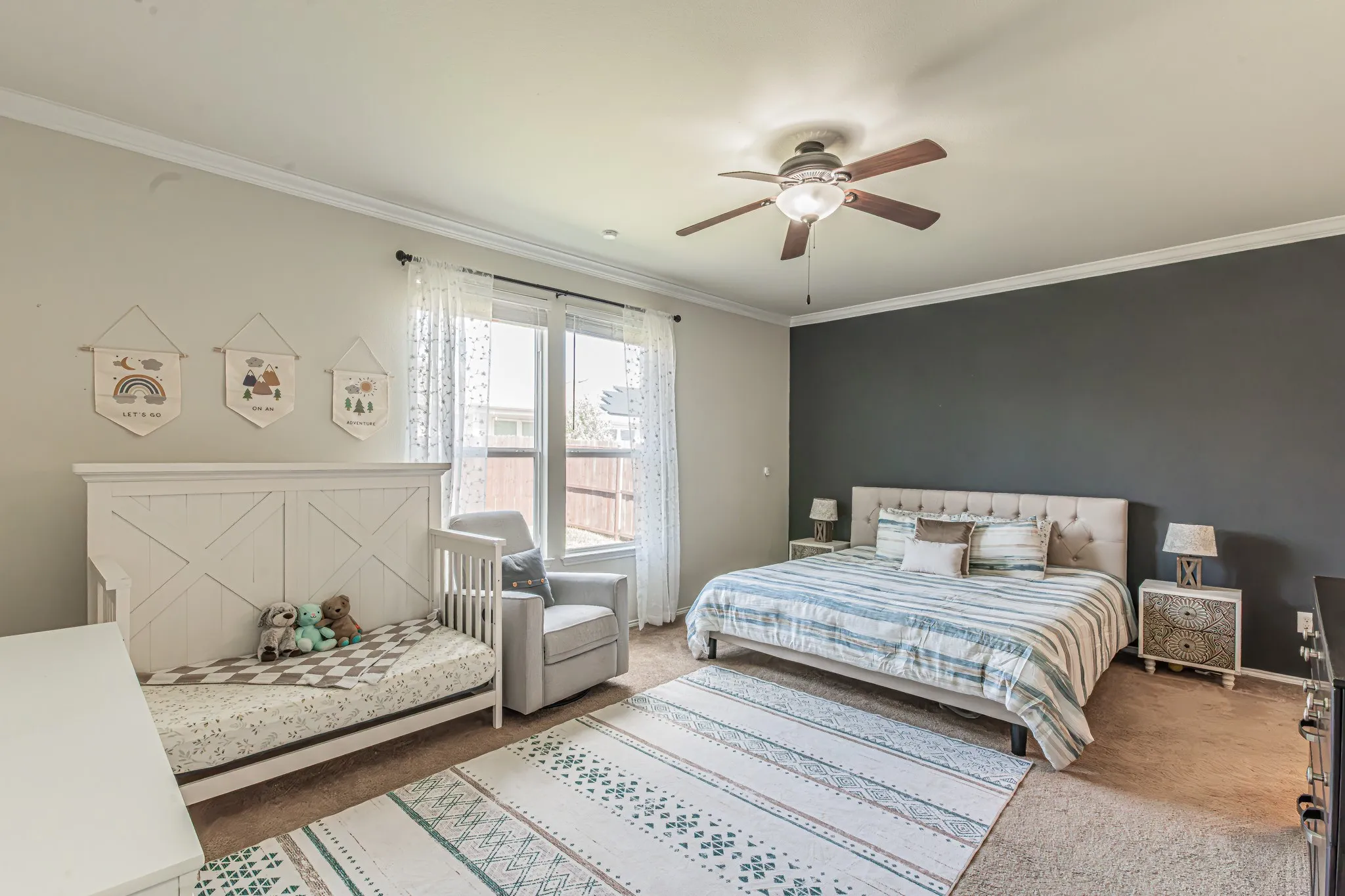 Oversized primary bedroom with accent wall and room to decorate as you wish.