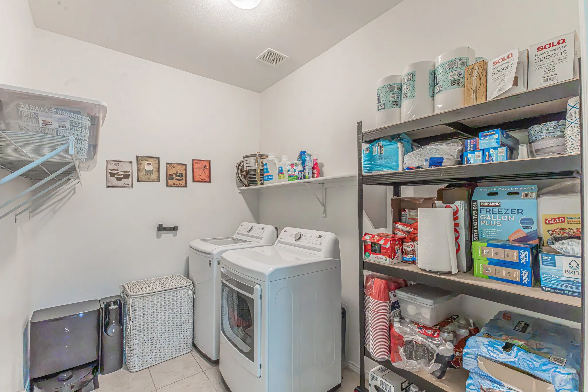 Large Utility area with room for a second fridge or extra storage space.