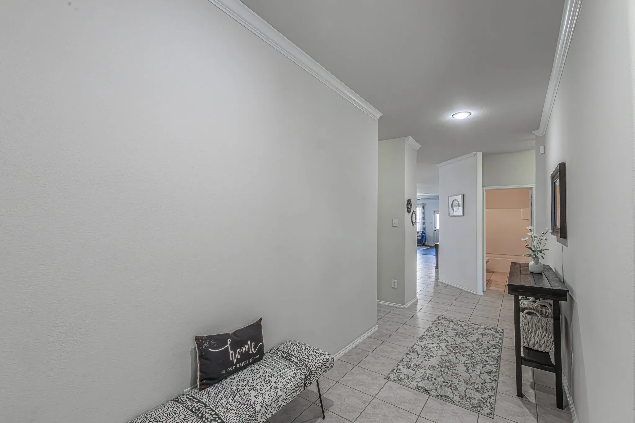 Open entryway into this beautiful home with plenty of wall space to decorate.