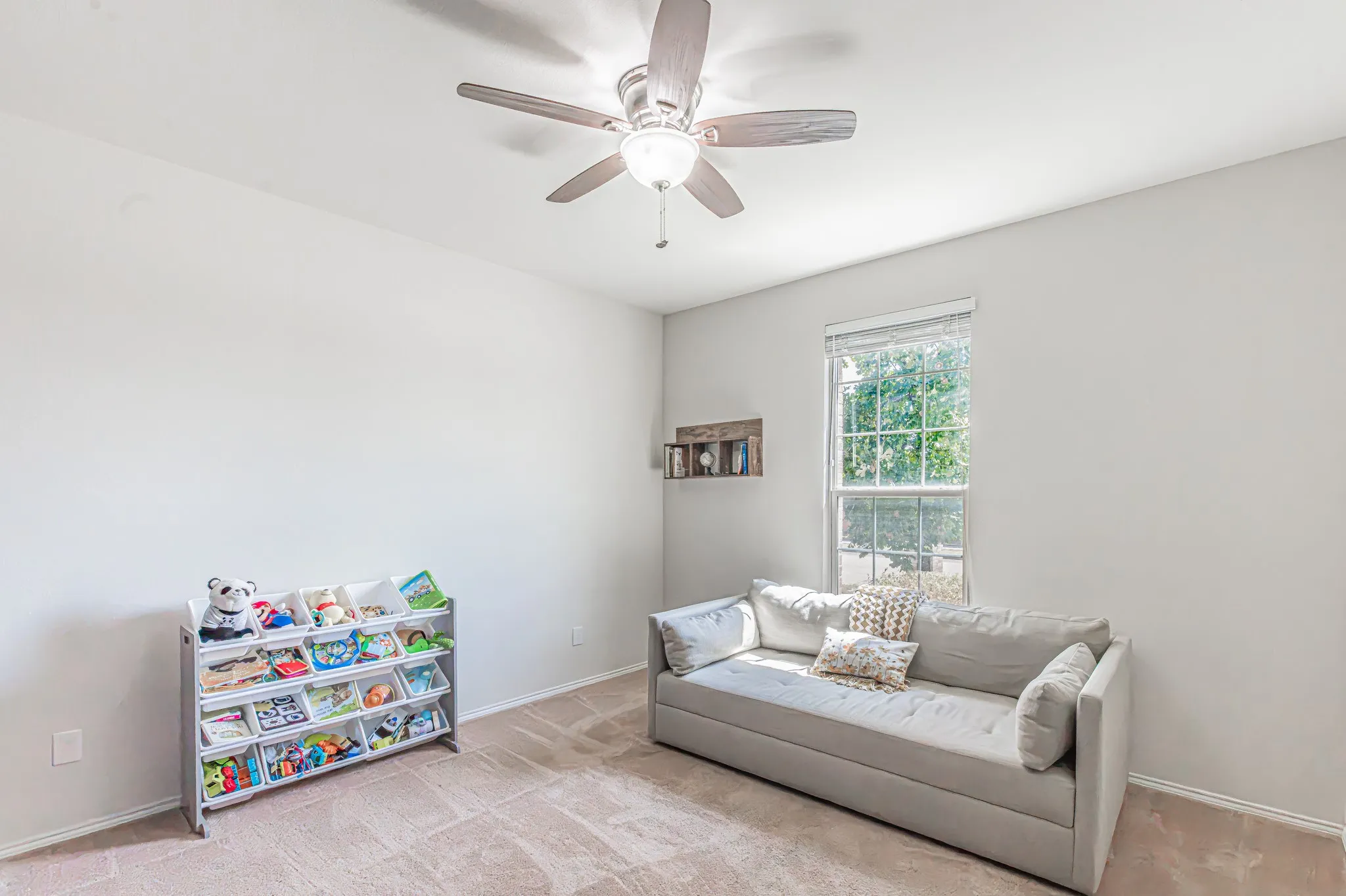 Light and bright bonus room right off the front entry.