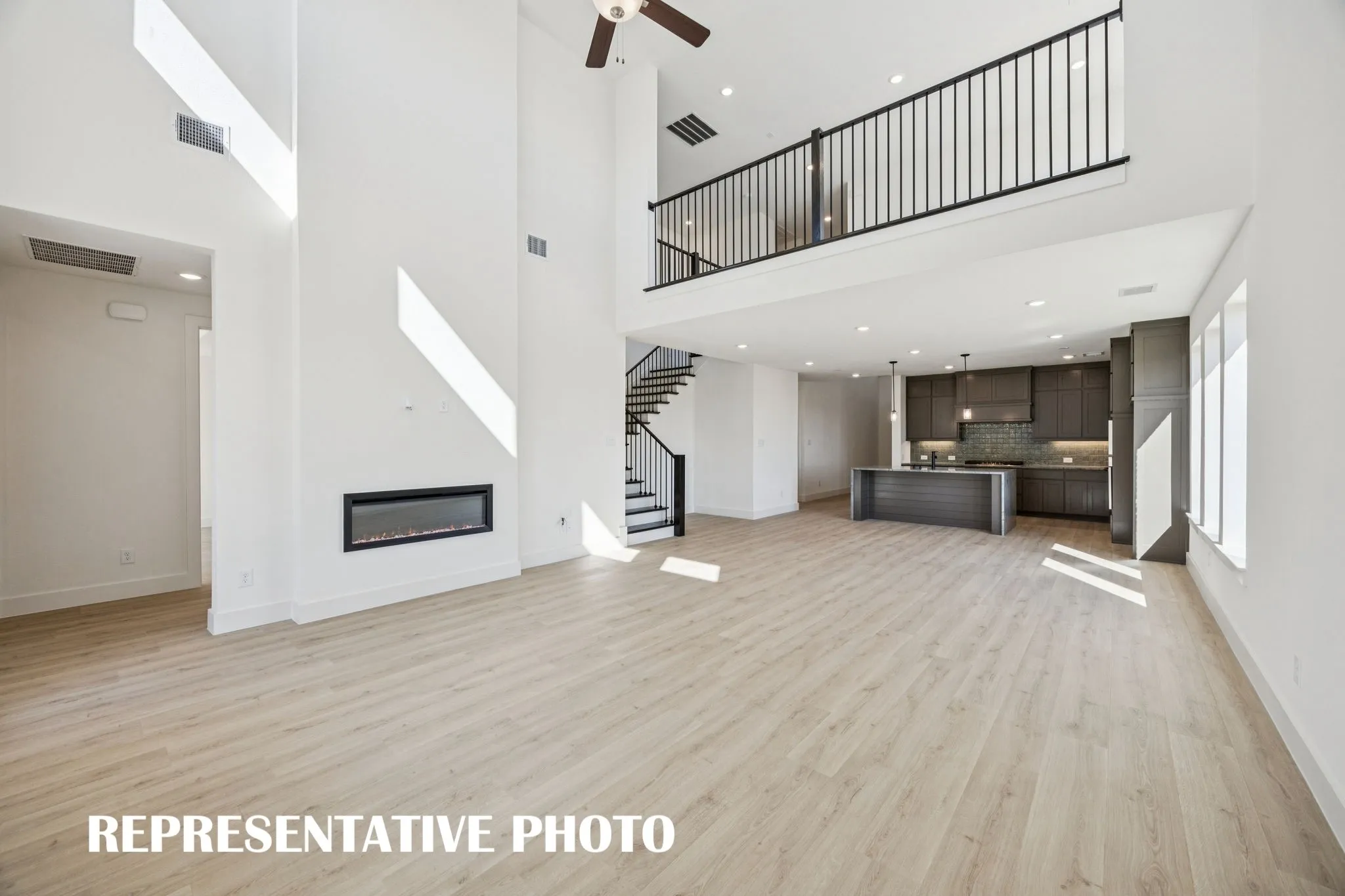With the upstairs game room open the main family room, you'll enjoy multi-level entertaining in our Percy plan. REPRESENTATIVE PHOTO