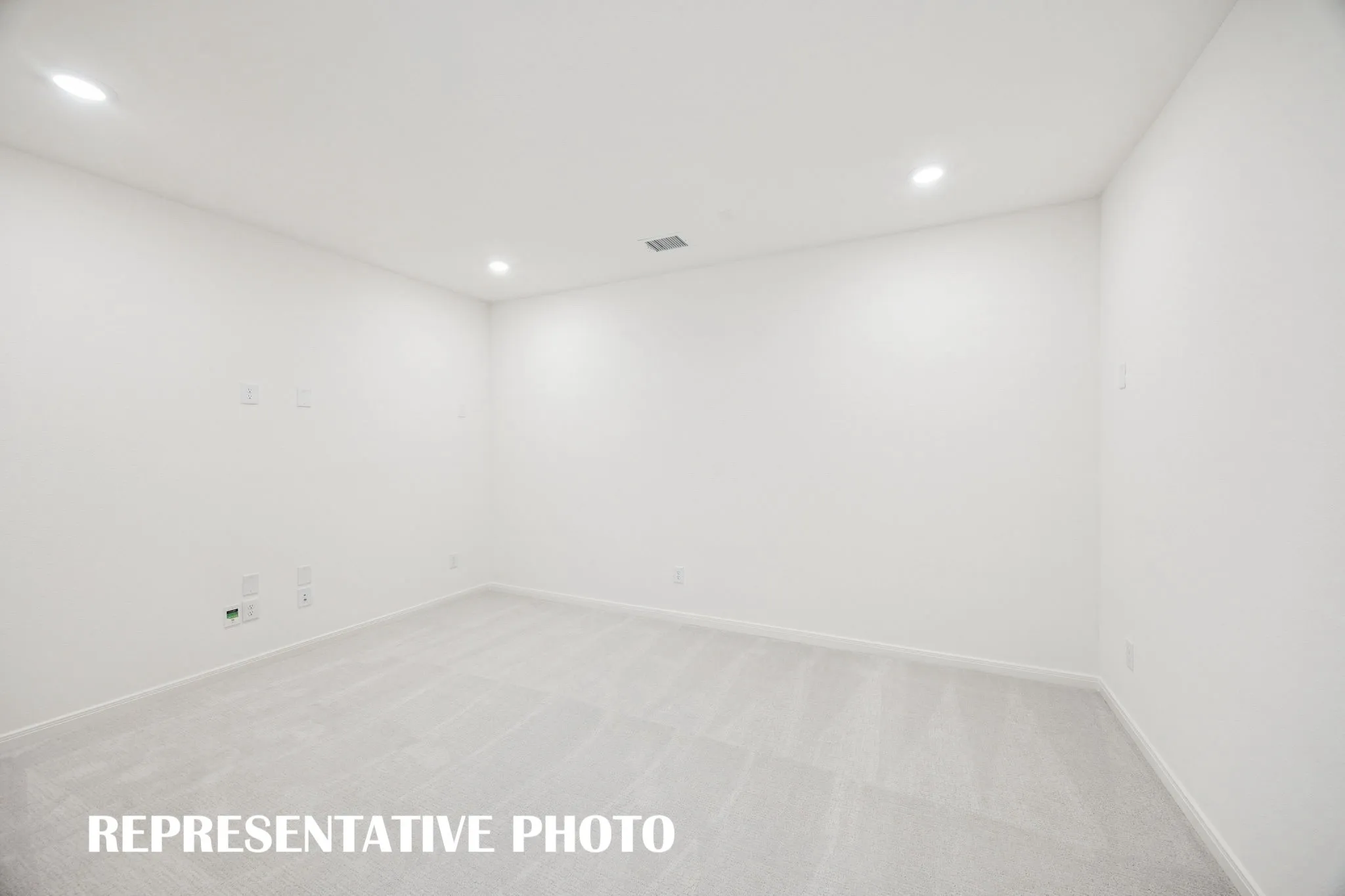This spacious media room with adjacent game room create the ultimate entertainment zone! REPRESENTATIVE PHOTO