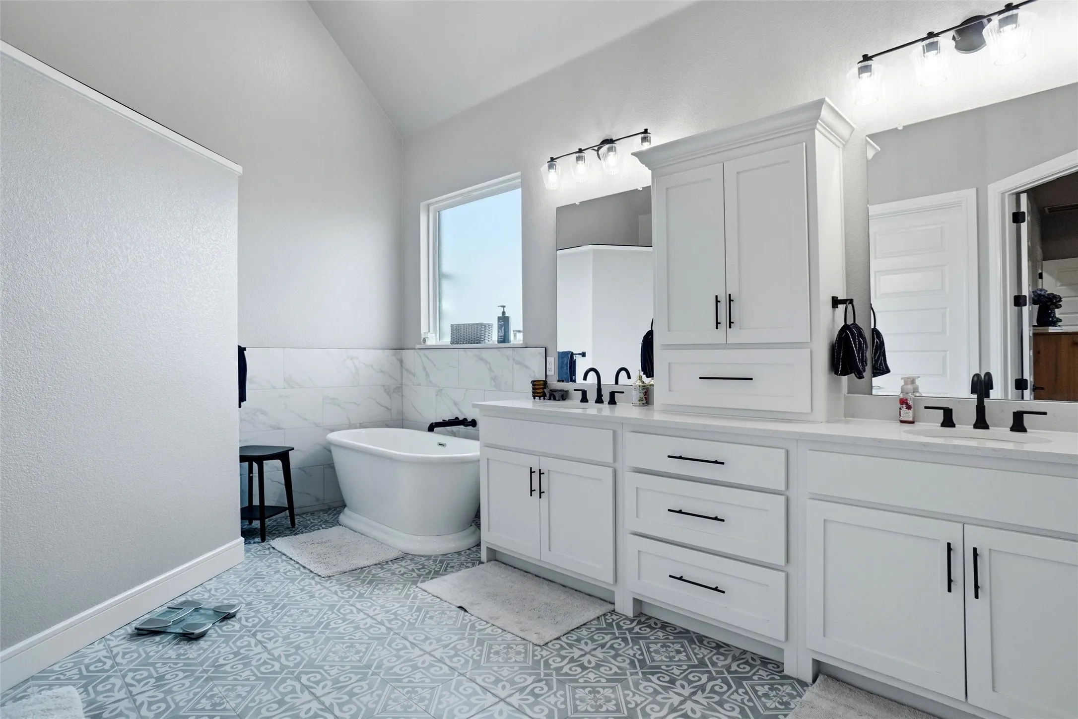 White double vanity with quartz countertops and an abundance of cabinet space