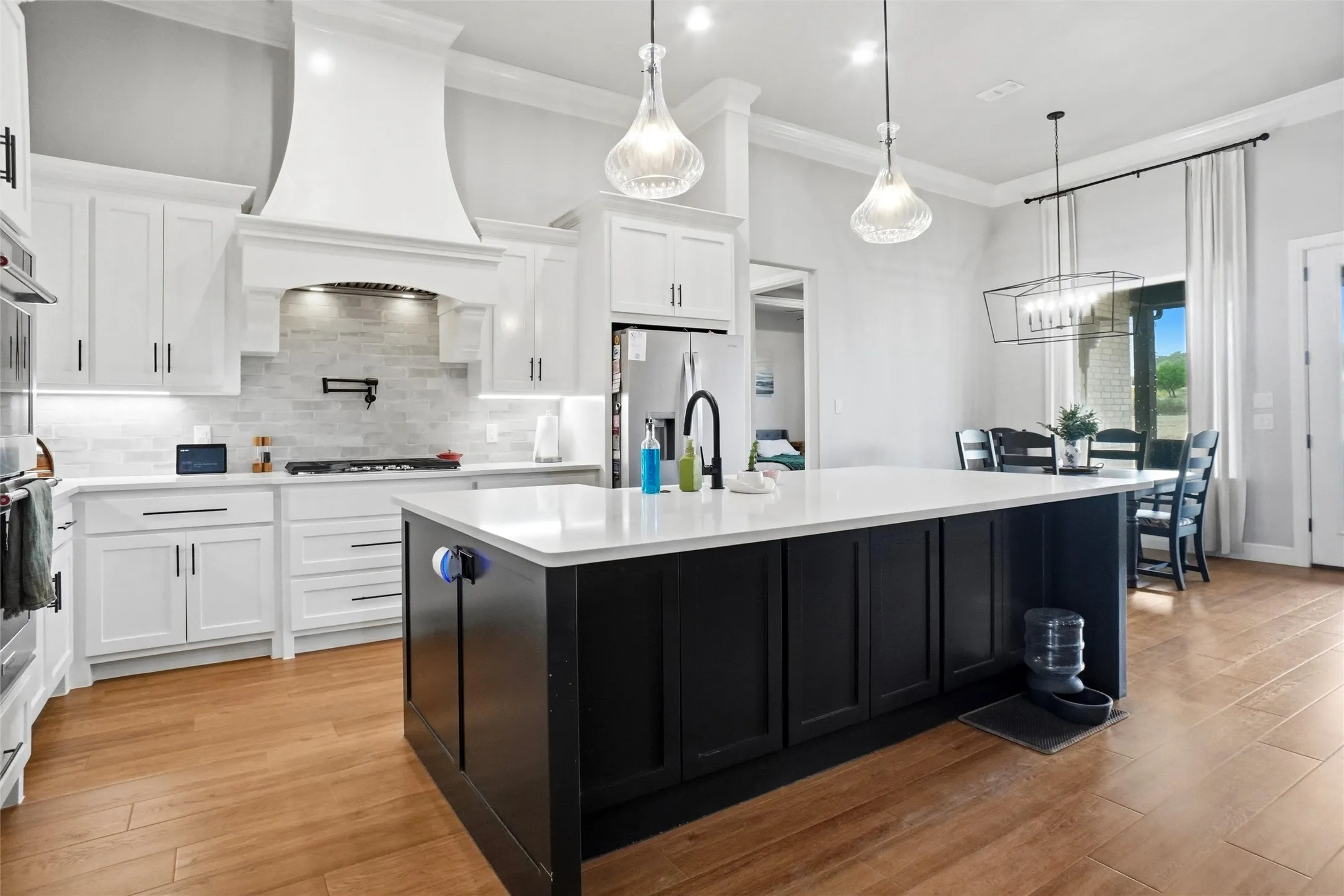 Beautiful custom kitchen with gas cooking, a pot filler and ample of counter space