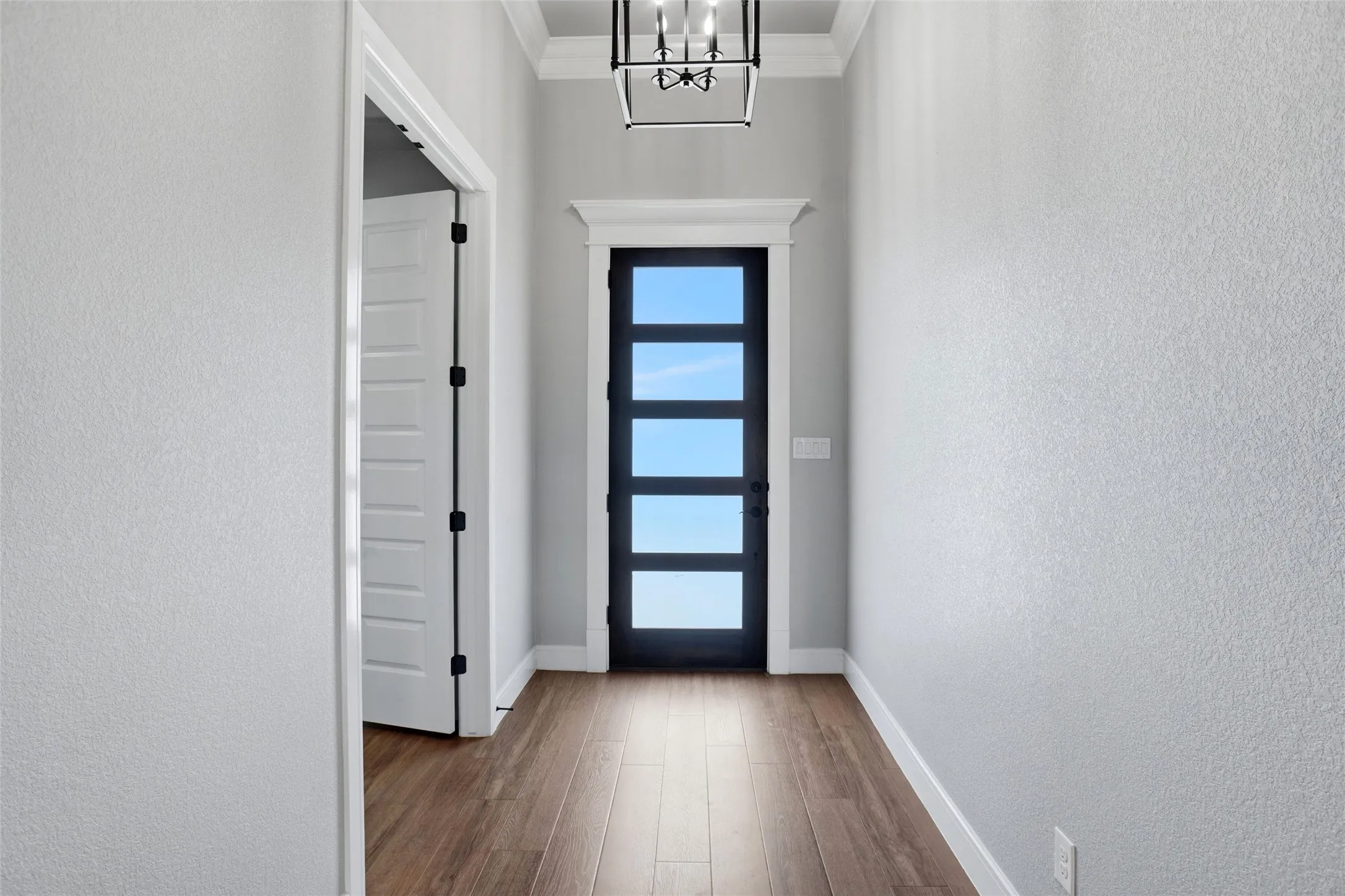 Beautiful entry way featuring a custom door